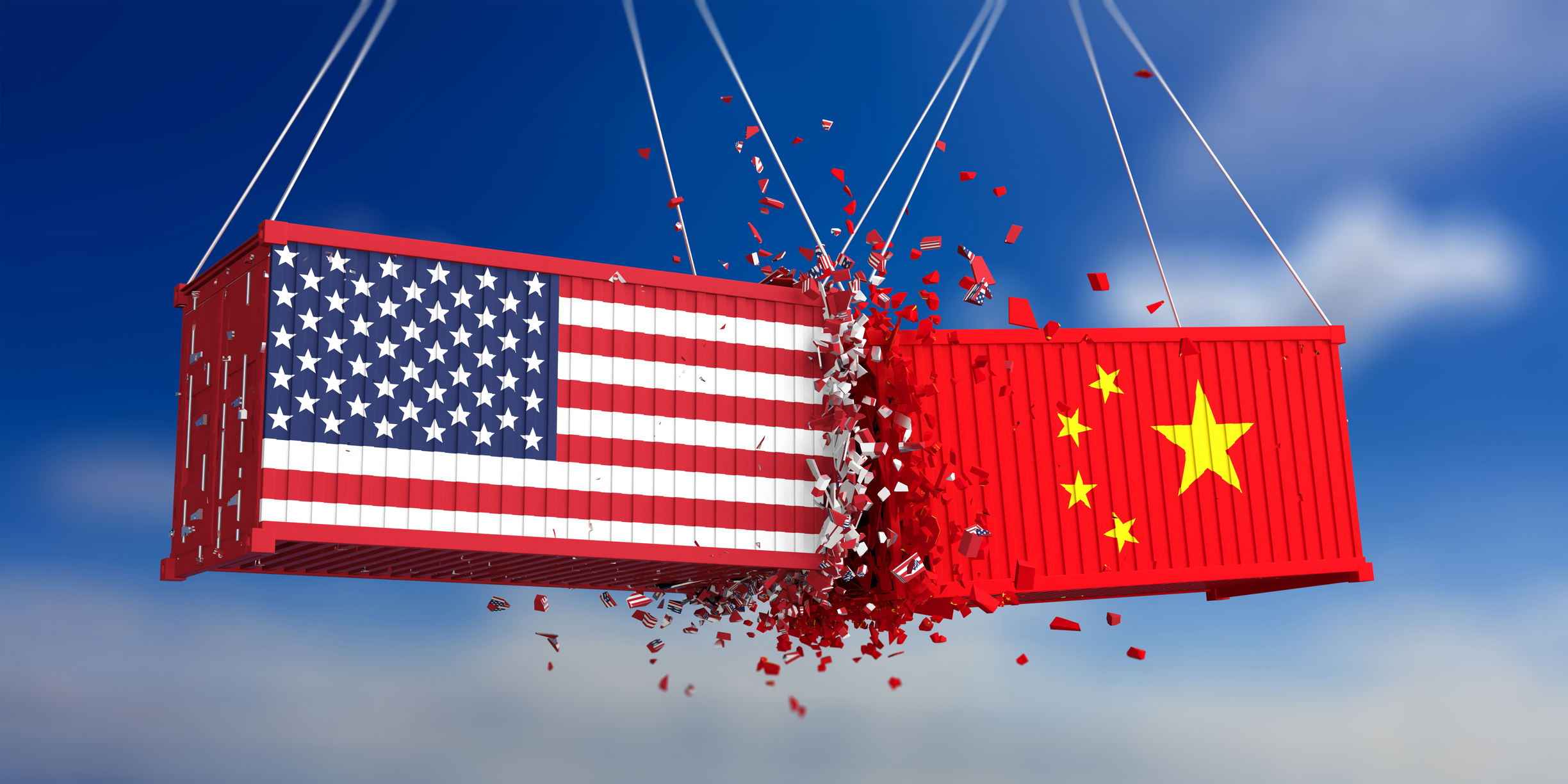 Two freight containers, hoisted by unseen cranes, colliding mid-air. One is painted in the American flag and the other displays the Chinese flag.