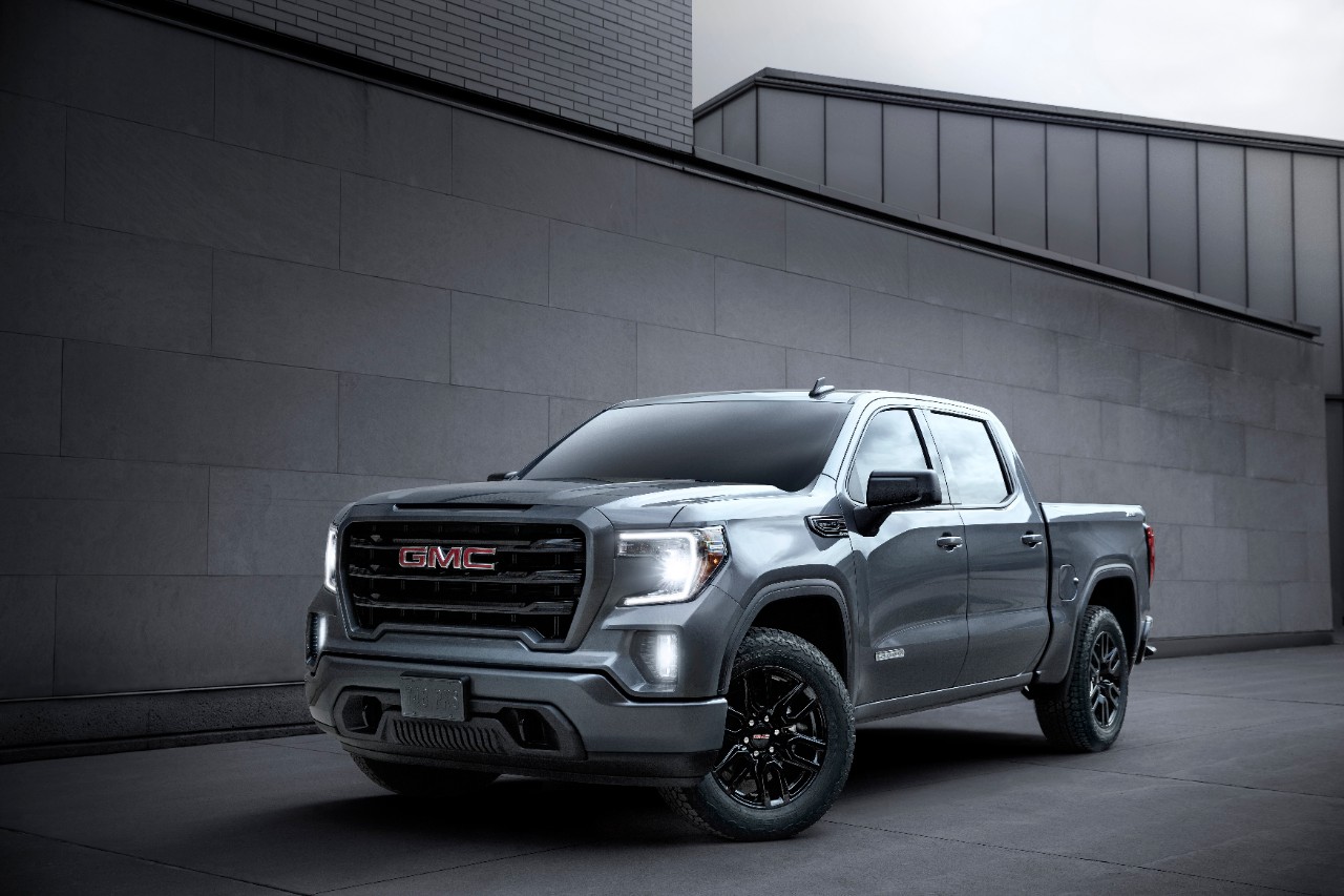 A 2020 GMC Sierra Elevation Crew Cab parked next to a building.