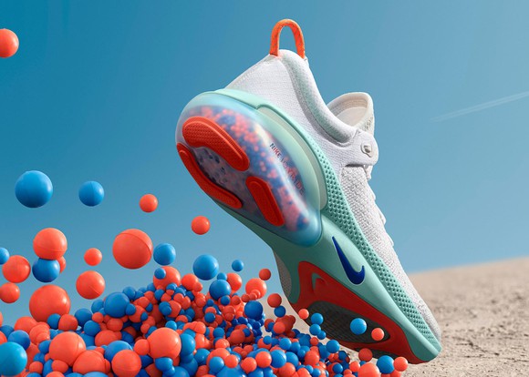 A Nike Joyride shoe with illustrated cushioning beads underneath it.