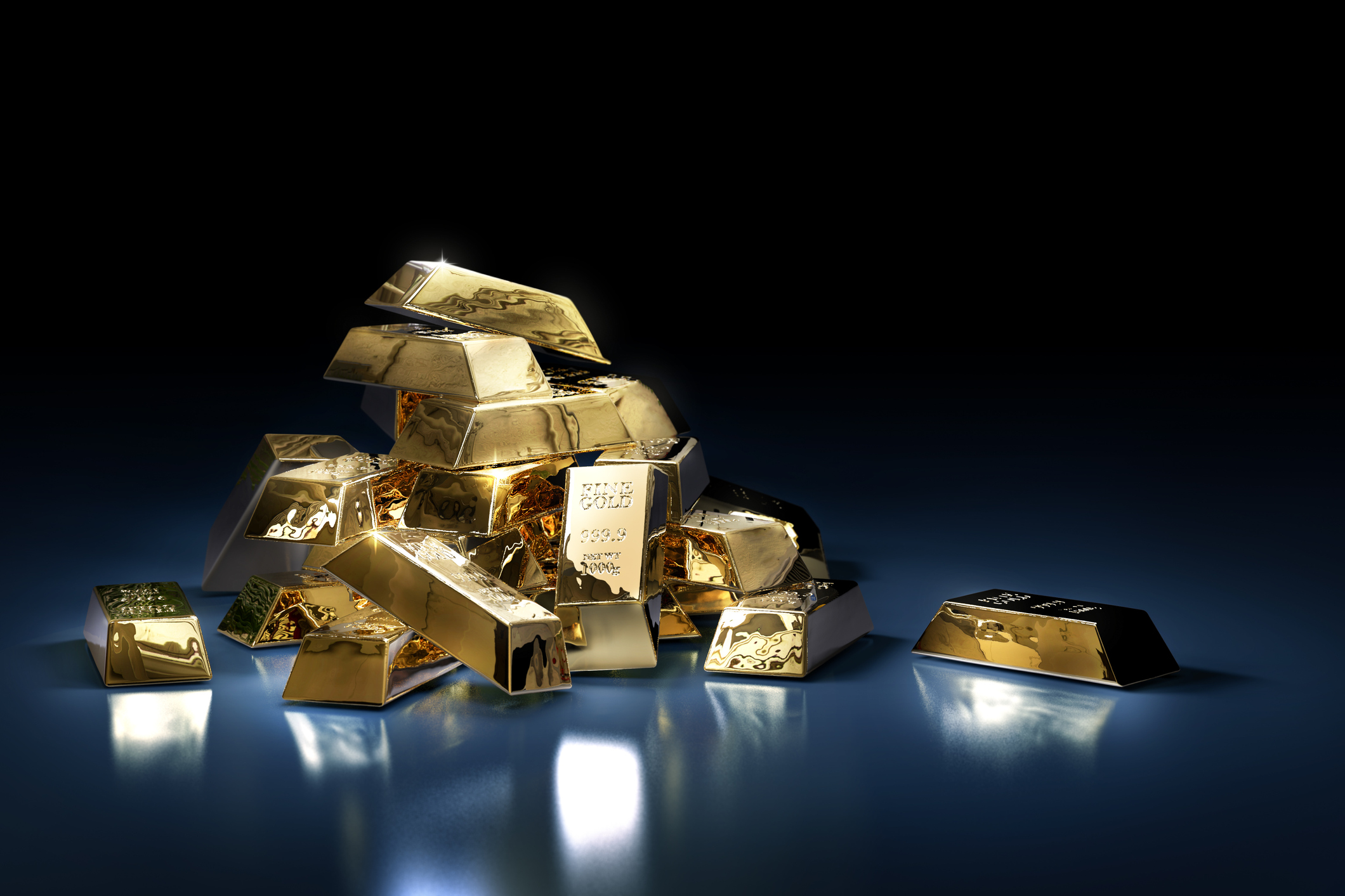 A pile of gold bars on a dark background.