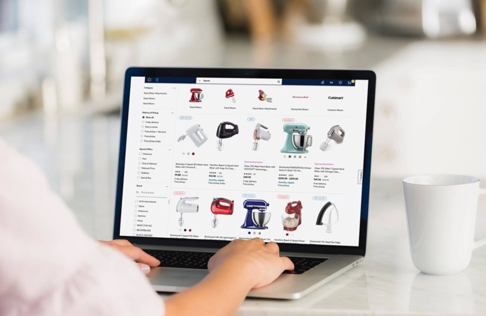 A person viewing Walmart.com search results on a laptop