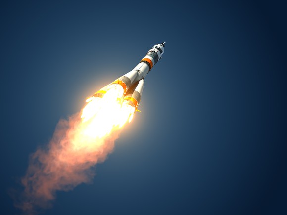 A rocket soars into space.