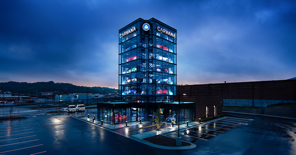 A Carvana car-vending tower at night.