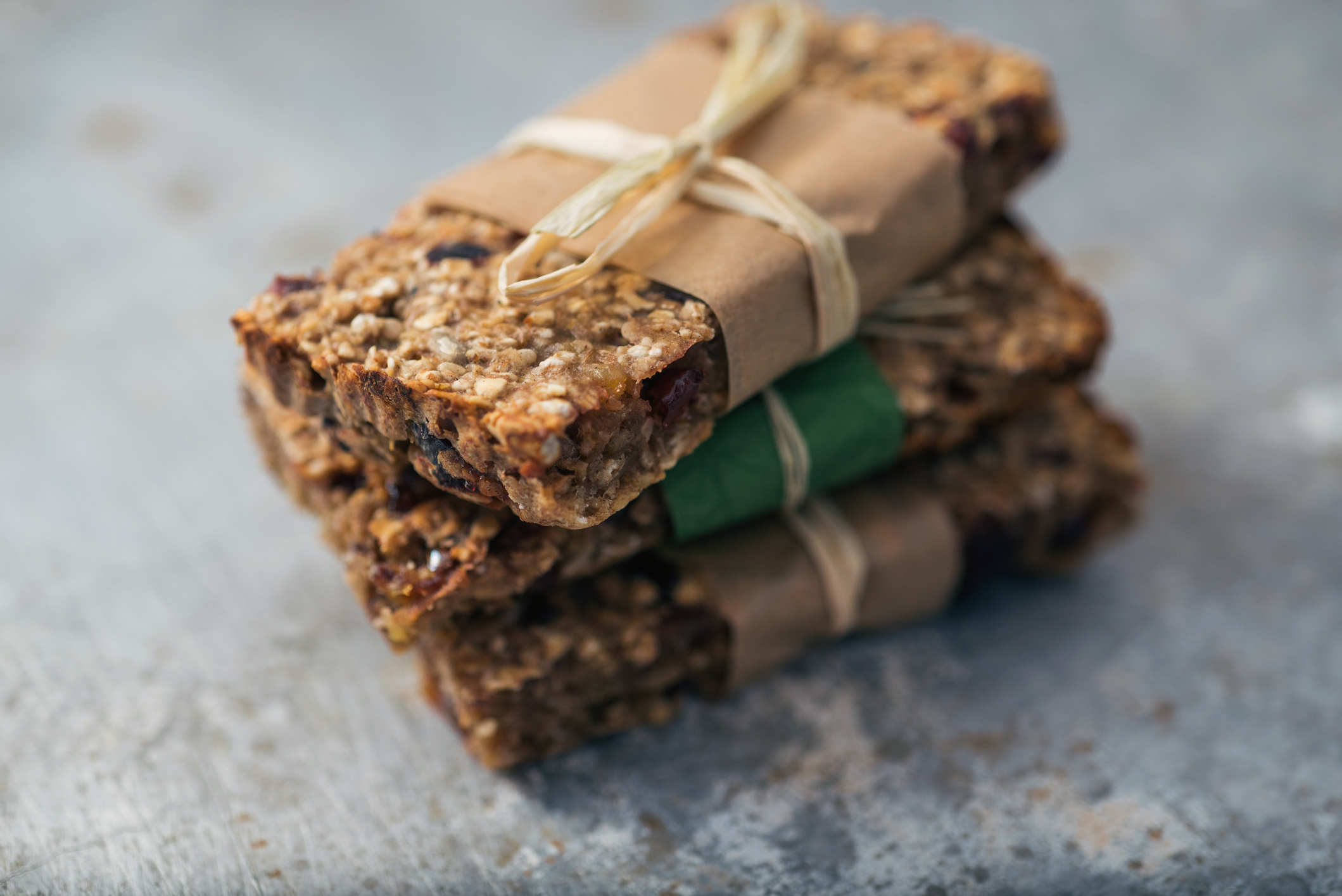 A stack of three healthy granola bars.