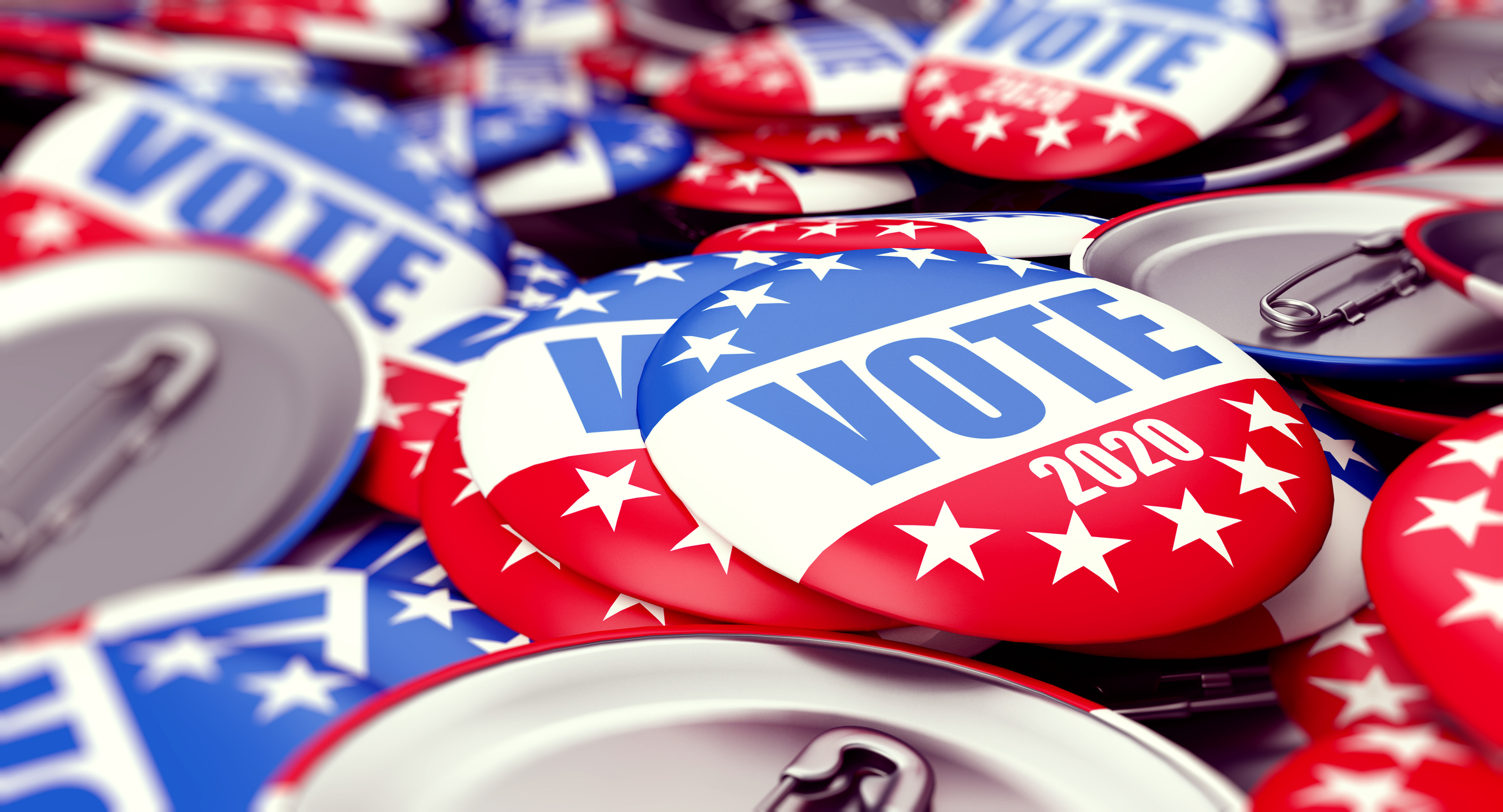 A pile of buttons that say VOTE 2020