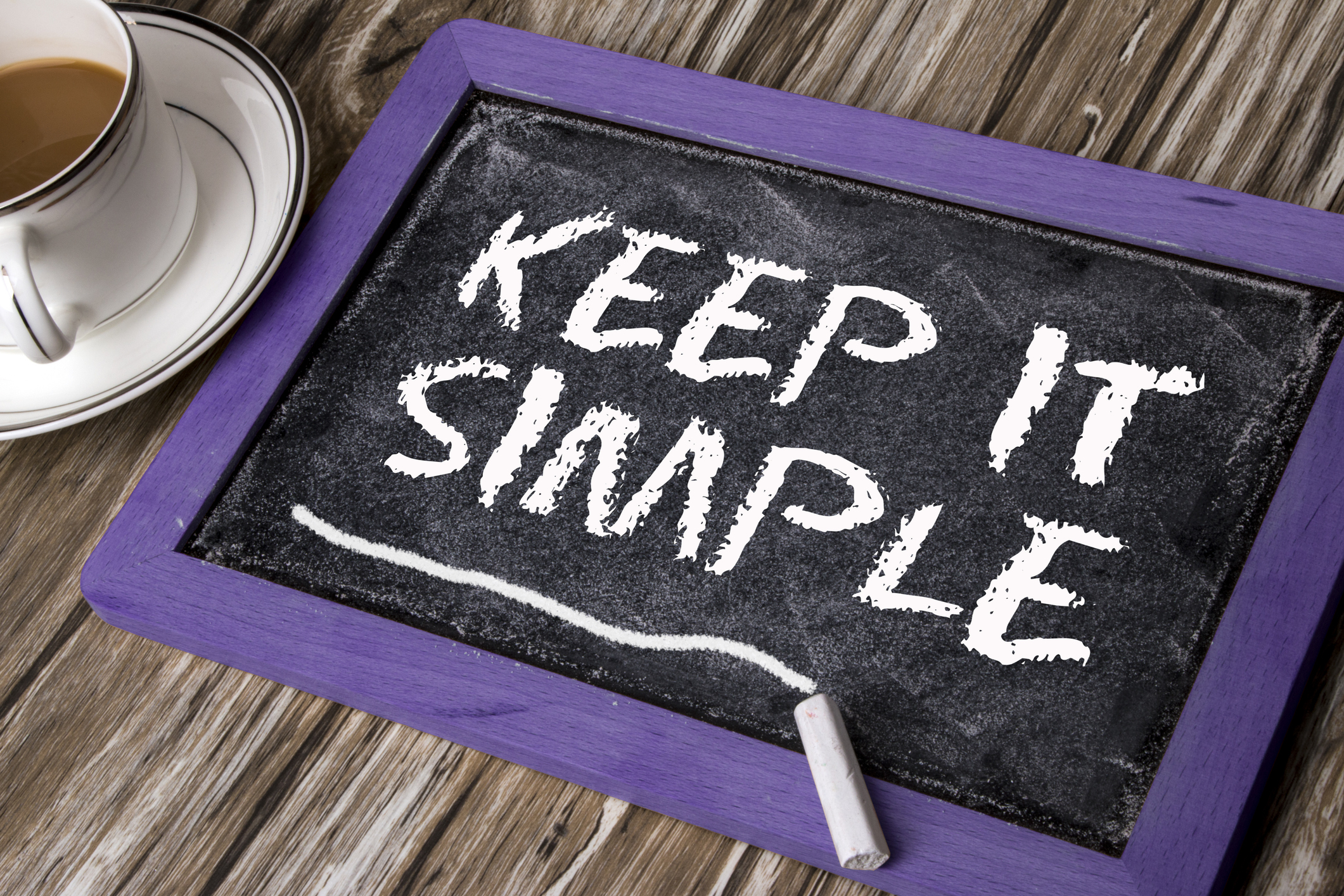 Chalk tablet with "Keep it simple" written on it