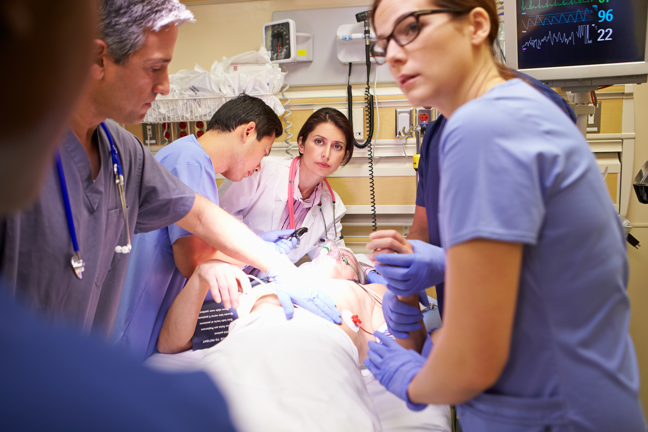 Doctors and Paramedics Surrounding Patient