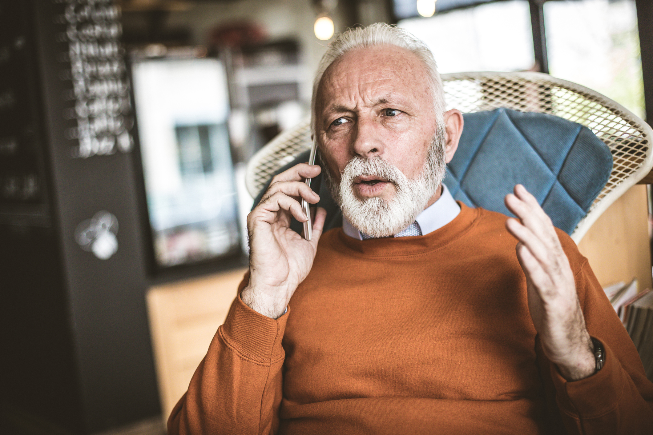 Older man talking on cell phone