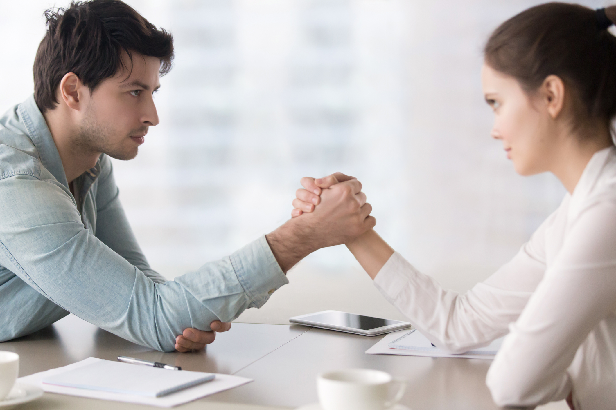 Business rivals armwrestling