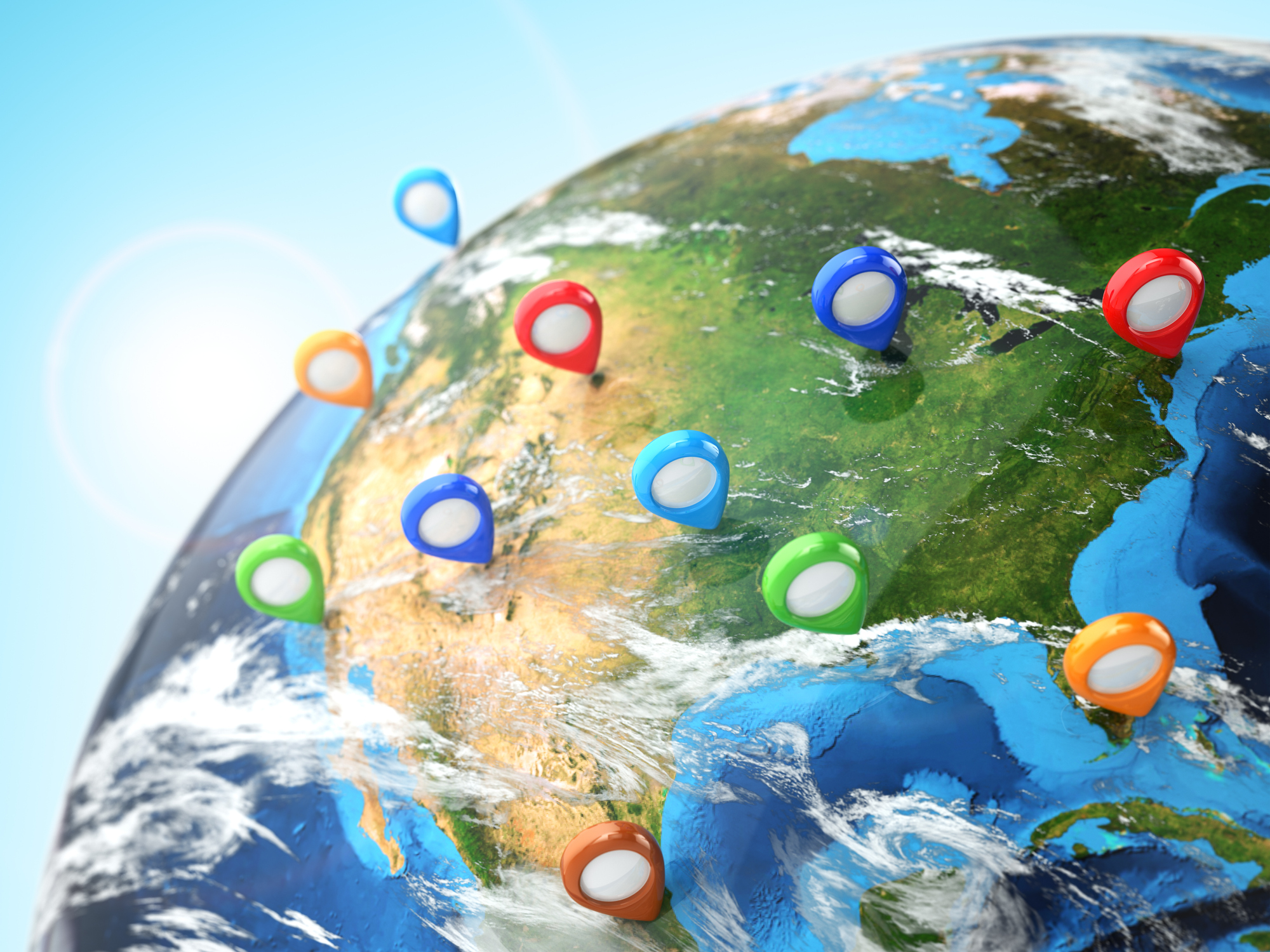 A globe with location markers dotted around North America