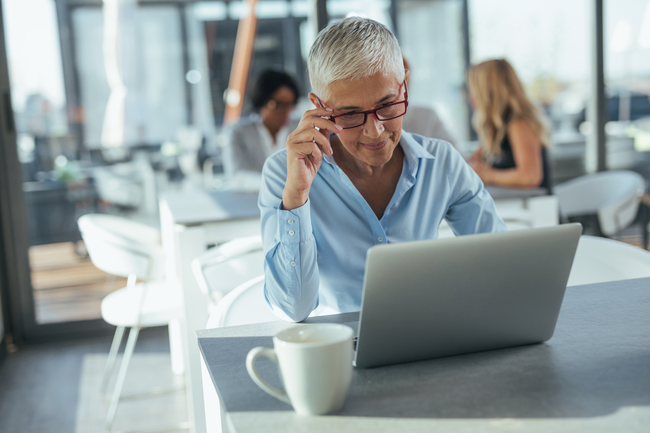 Older woman sitting at laptop