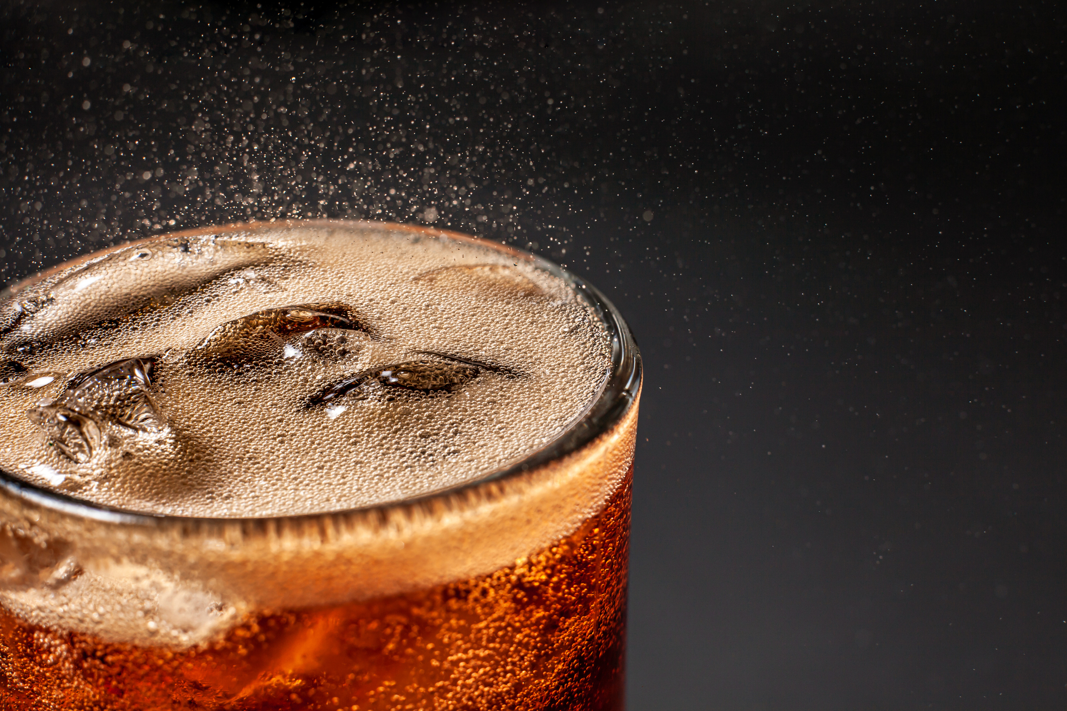 Close-up of a freshly-poured glass of cola.