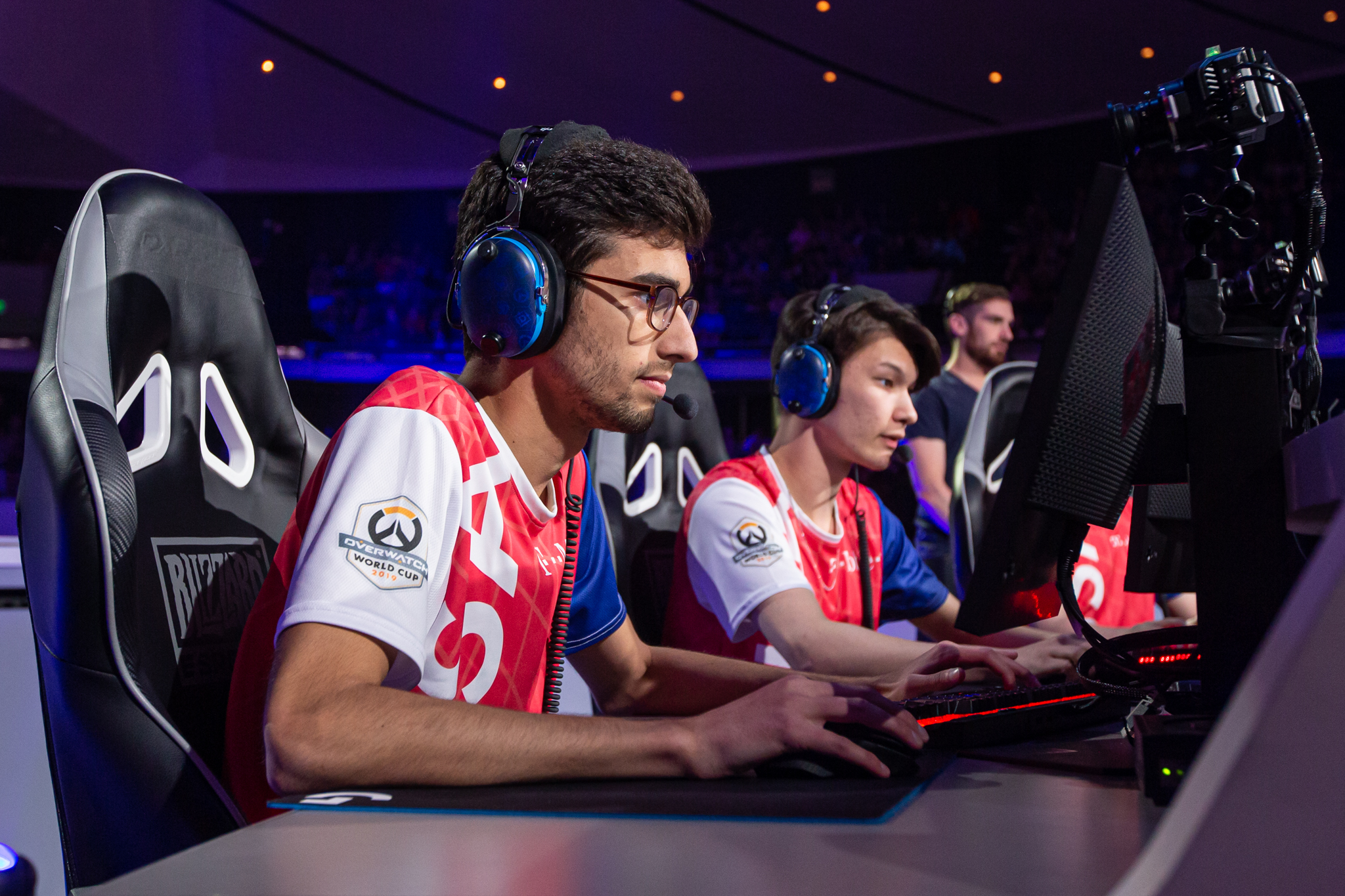 Esports players sitting in front of PCs.