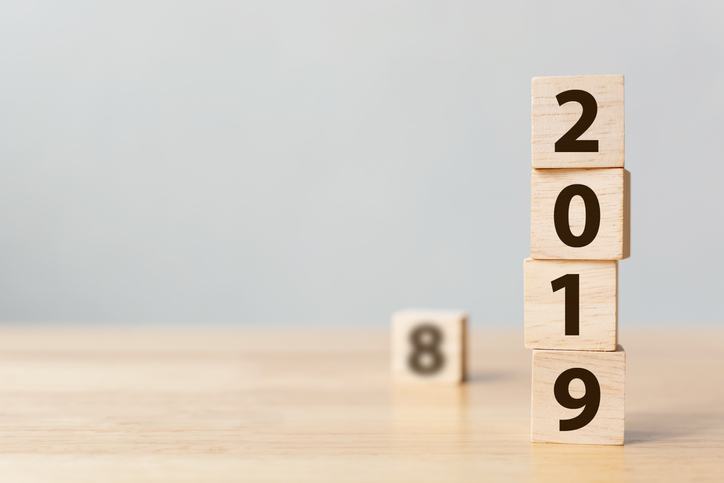 Wooden blocks reading 2019, with an 8 in the background.