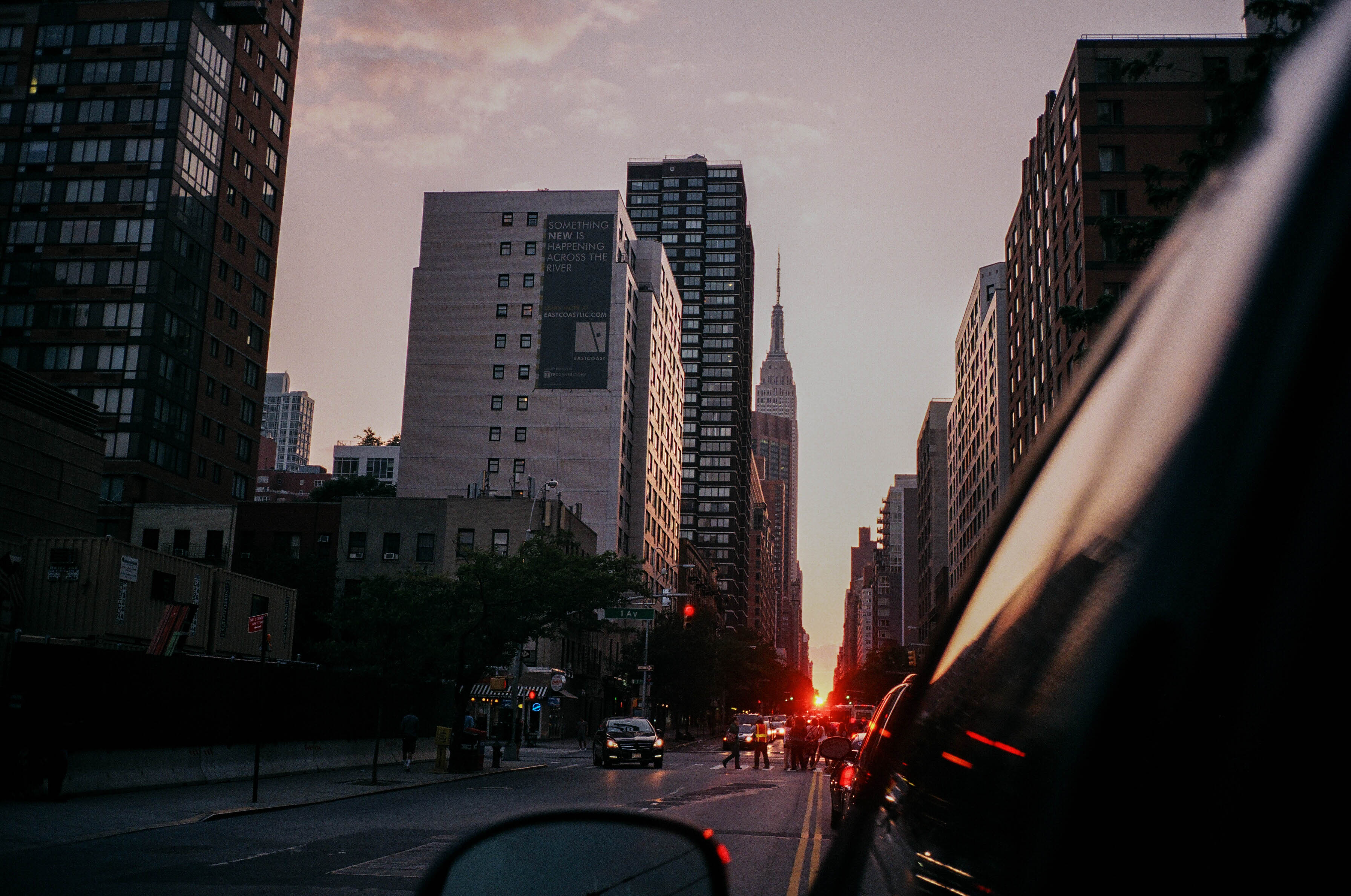 A view of a downtown cityscape from outside a car window.