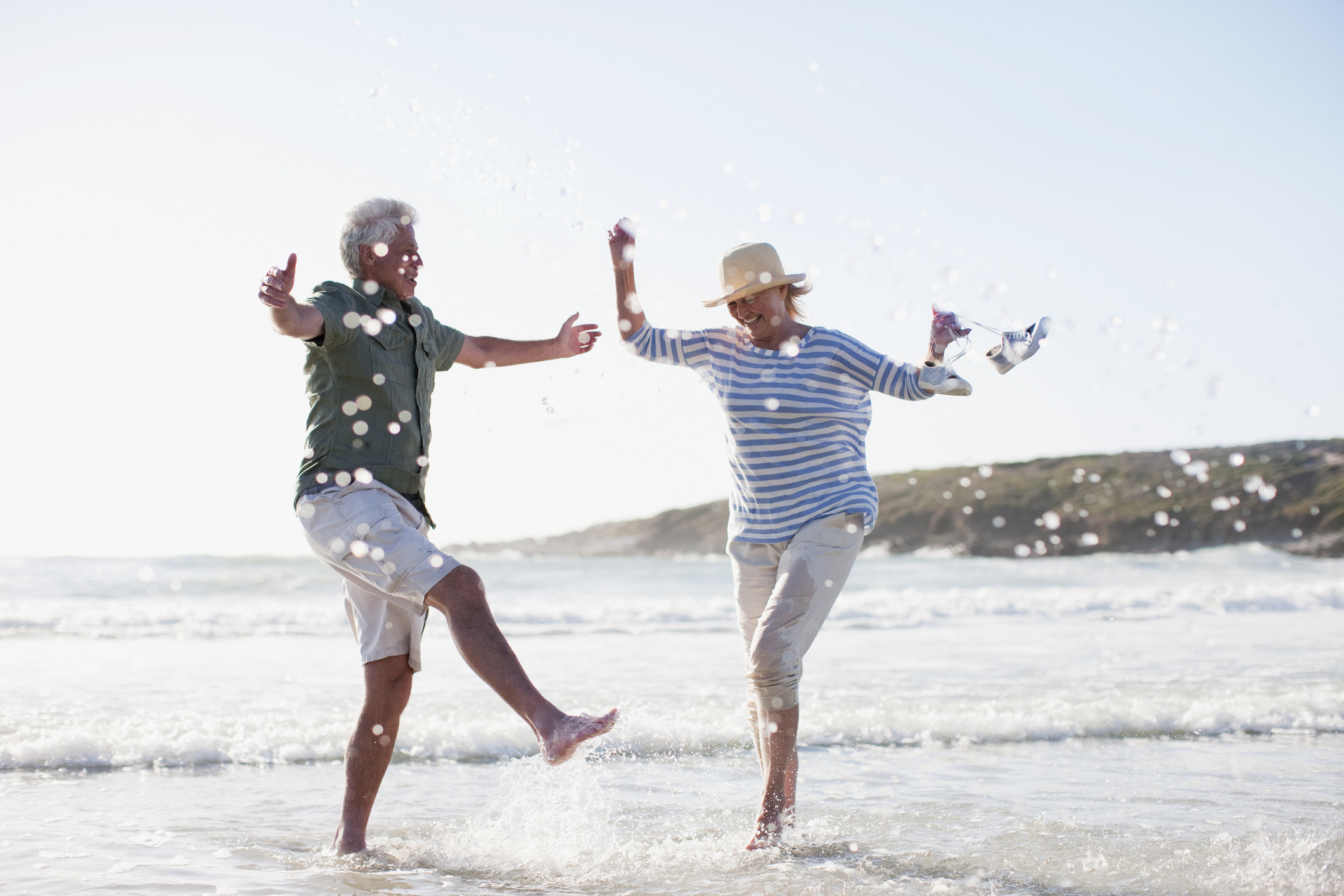 Senior couple dancing on the beach