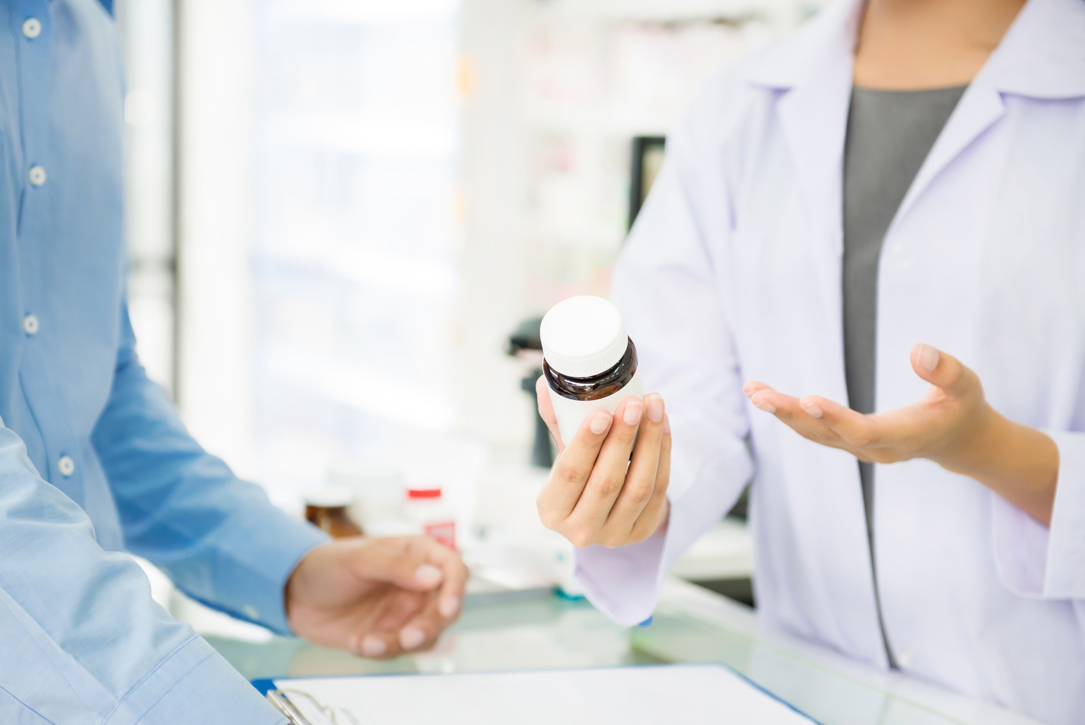 Pharmacist discussing a medication with a patient.