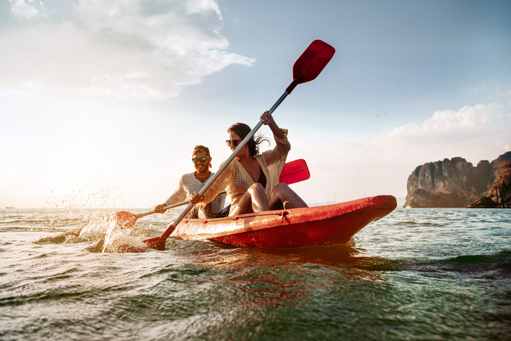 A couple kayaks on the open ocean.