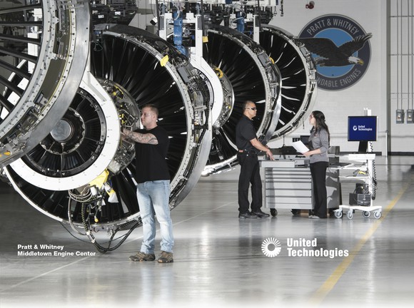 Aerospace engineers working on a engine assembly line.