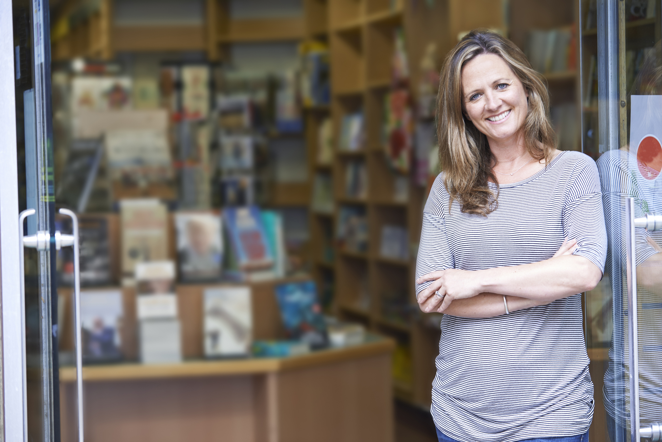 Smiling woman in front of bookstore