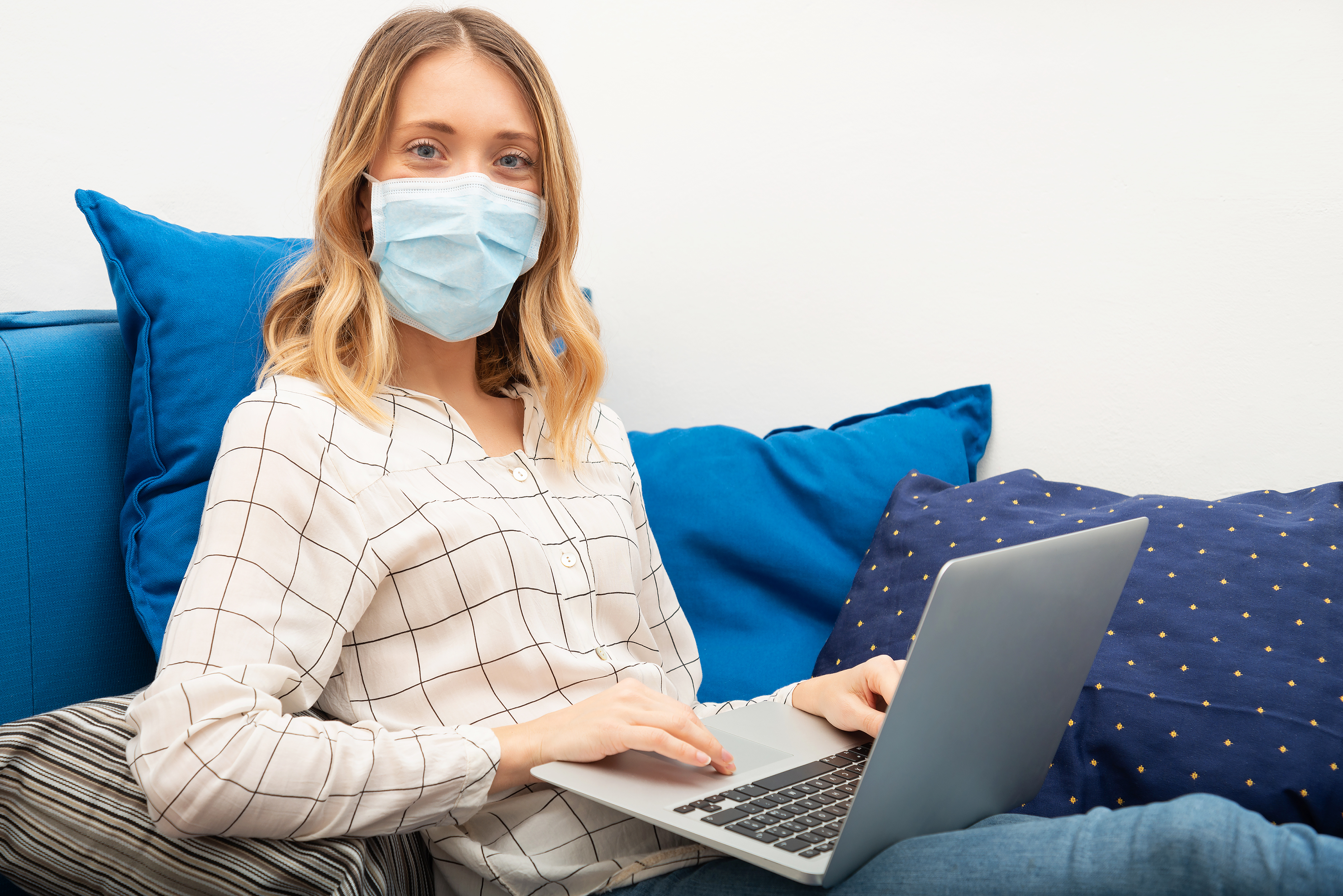 Working from home with a facemask.