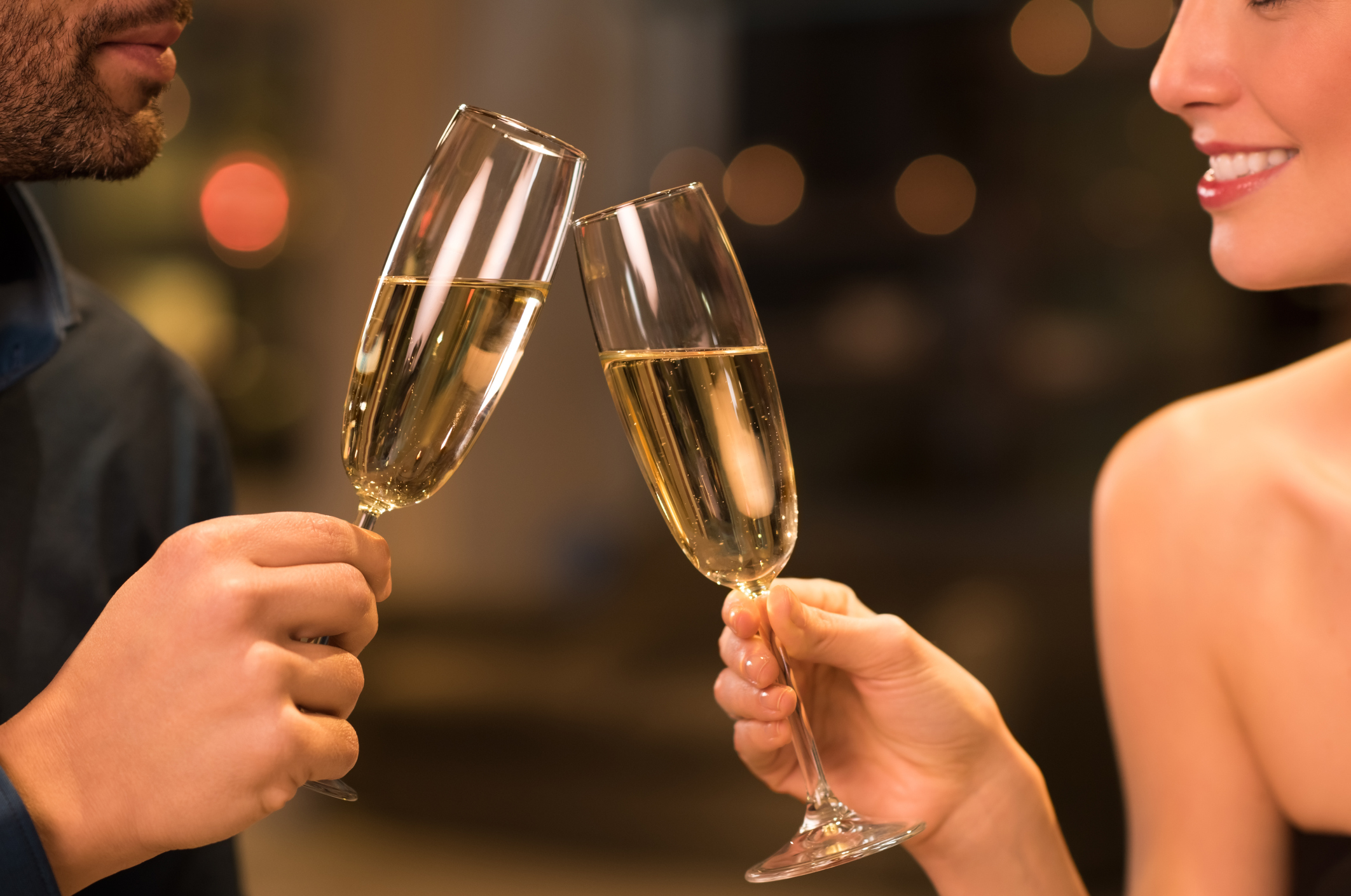 Couple toasting with champagne at a restaurant
