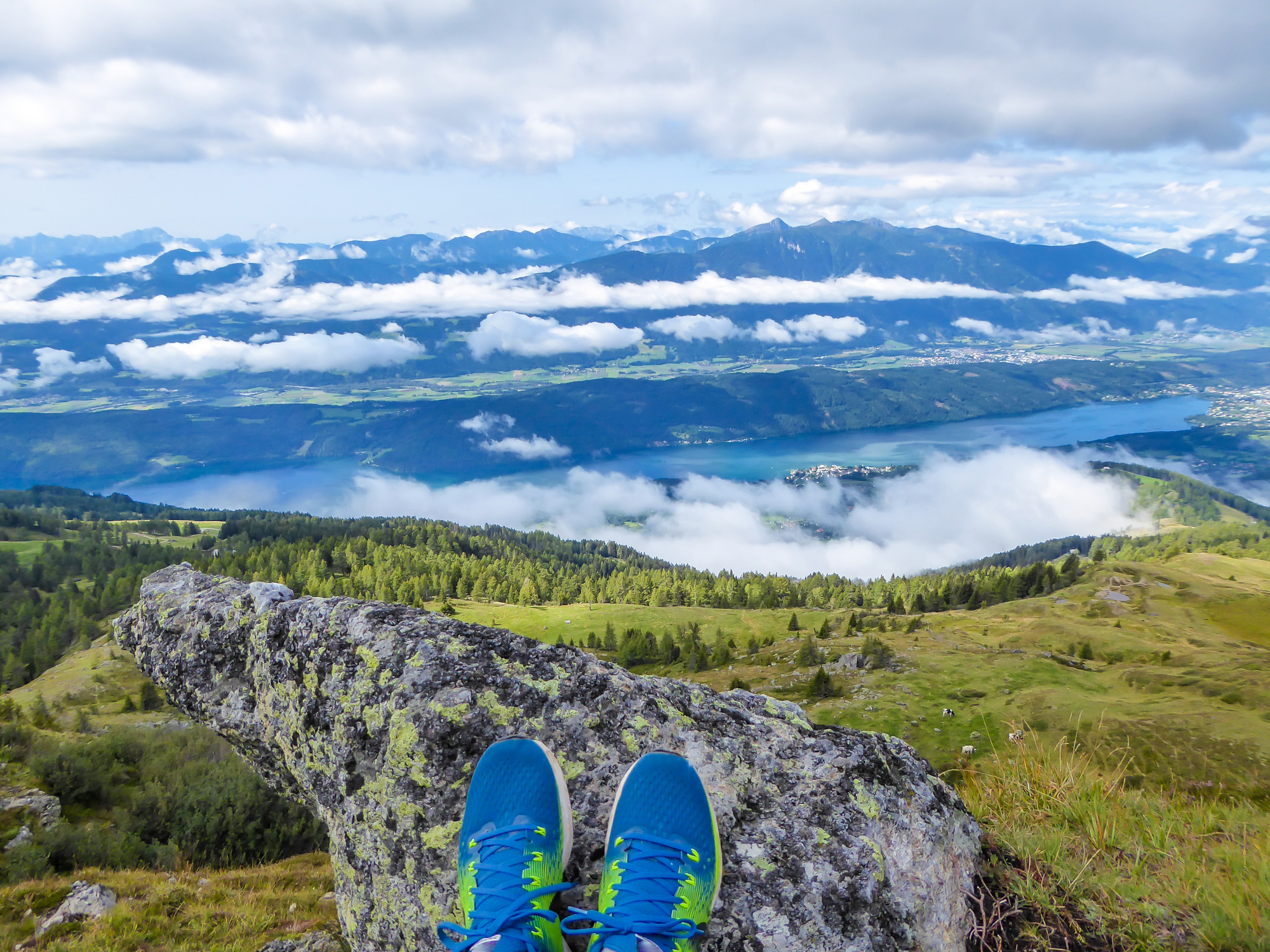 A vast landscape with a pair of athletic shoes appearing at the bottom.