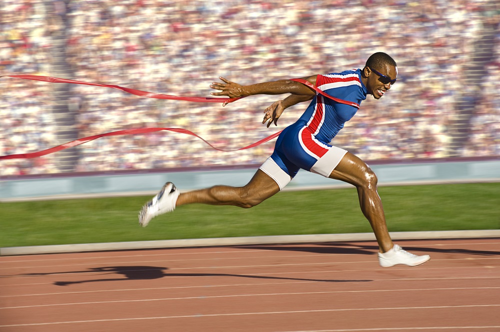 Runner crossing finish line.