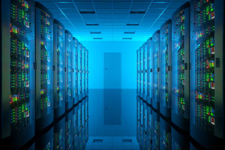 Interior of a data center lit with blue light.