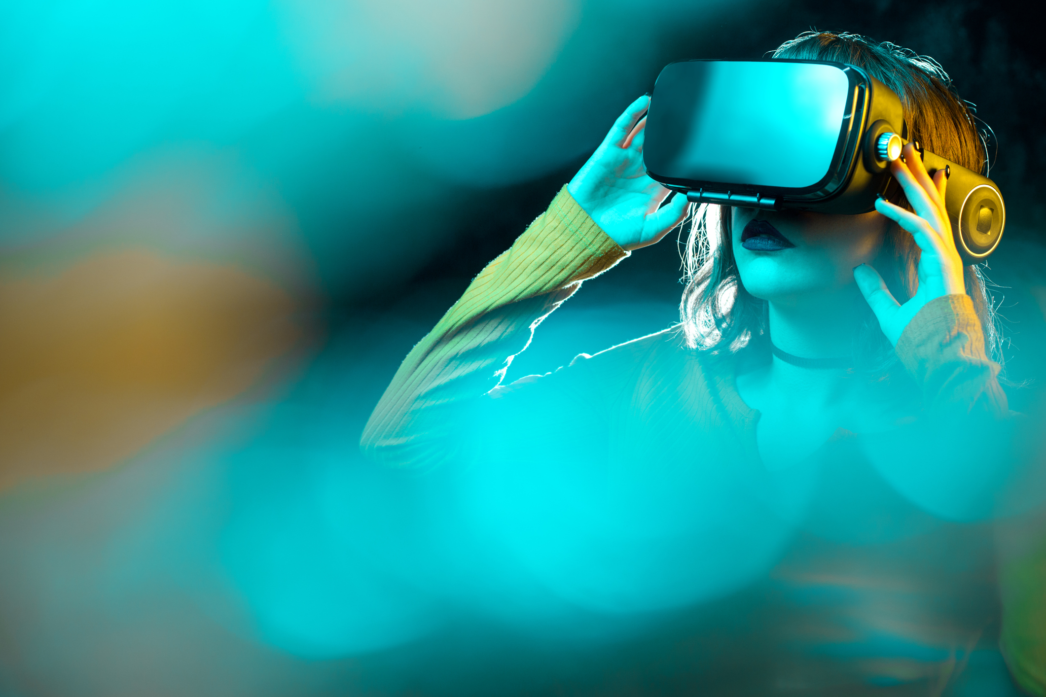 A woman wears a VR headset.
