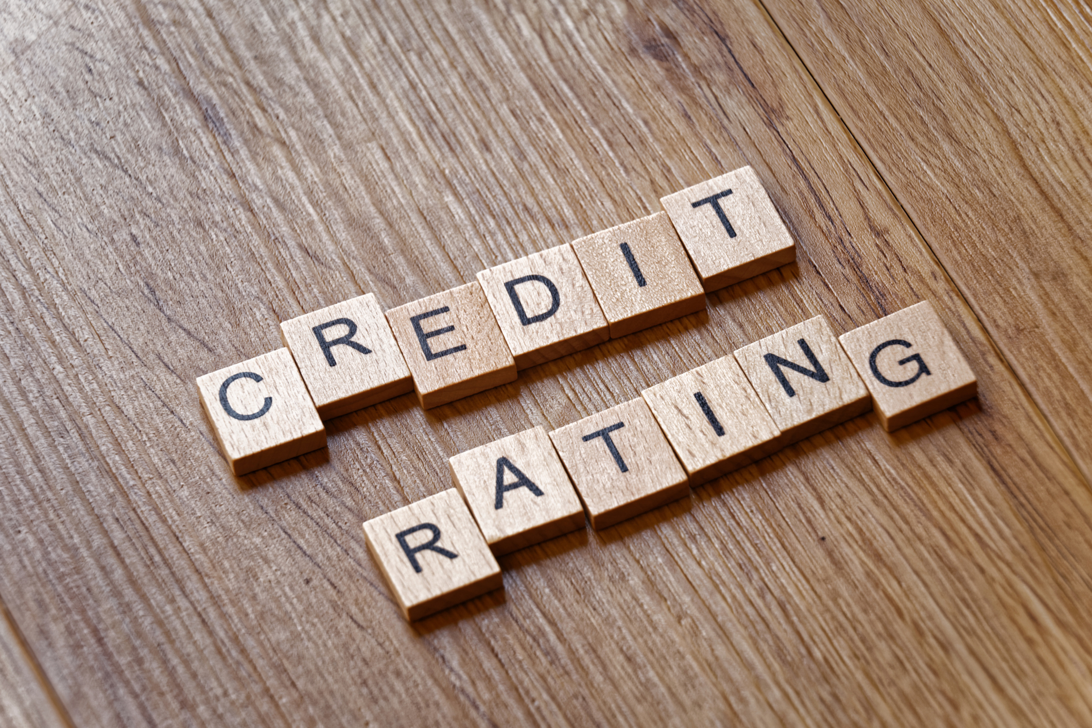 The words credit rating spelled out in Scrabble wooden letters