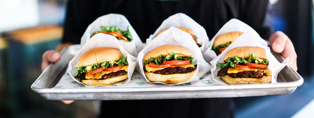 A tray of Shake Shack burgers.