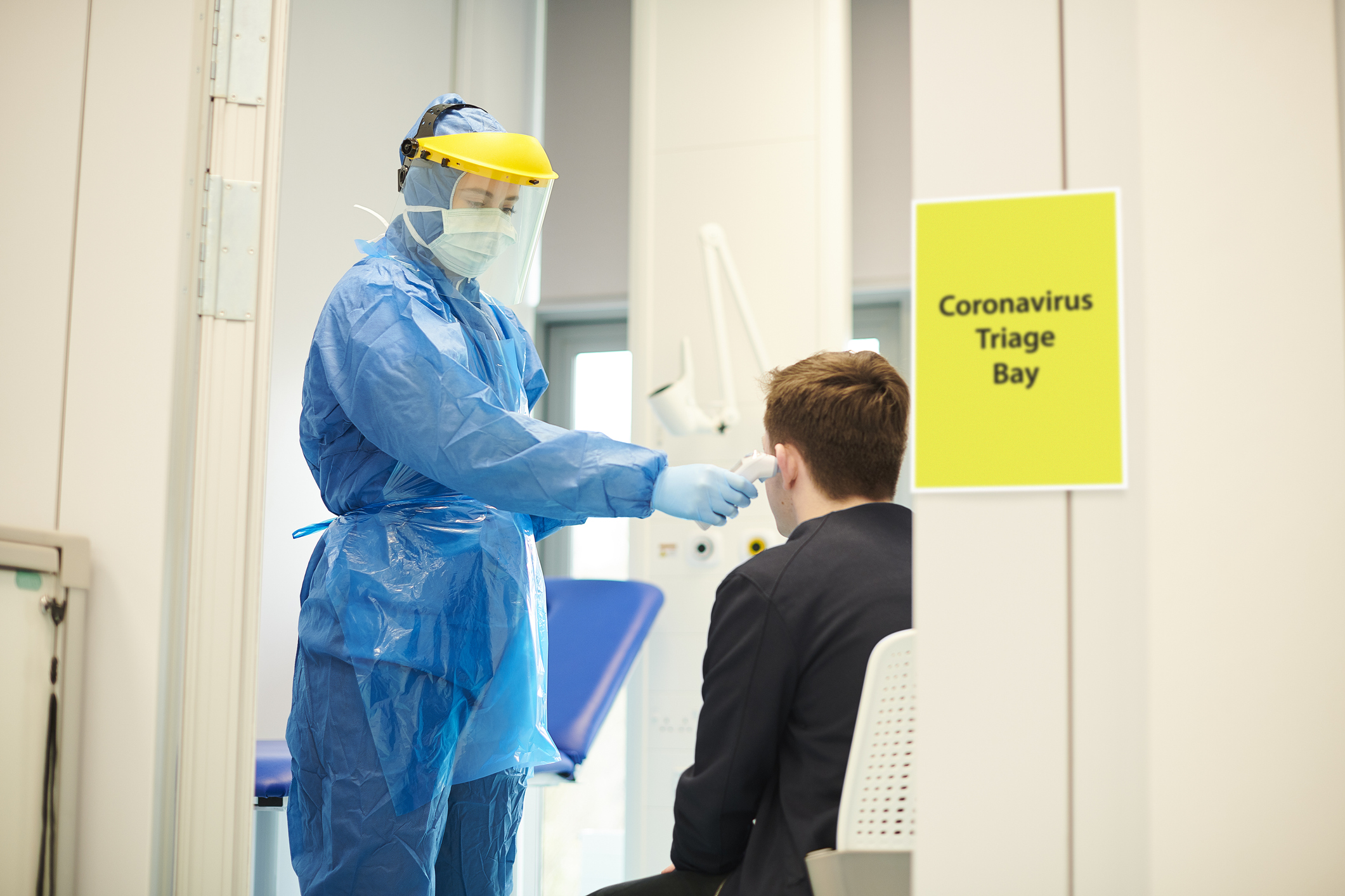 A doctor and patient in a Coronavirus triage bay in a hospital