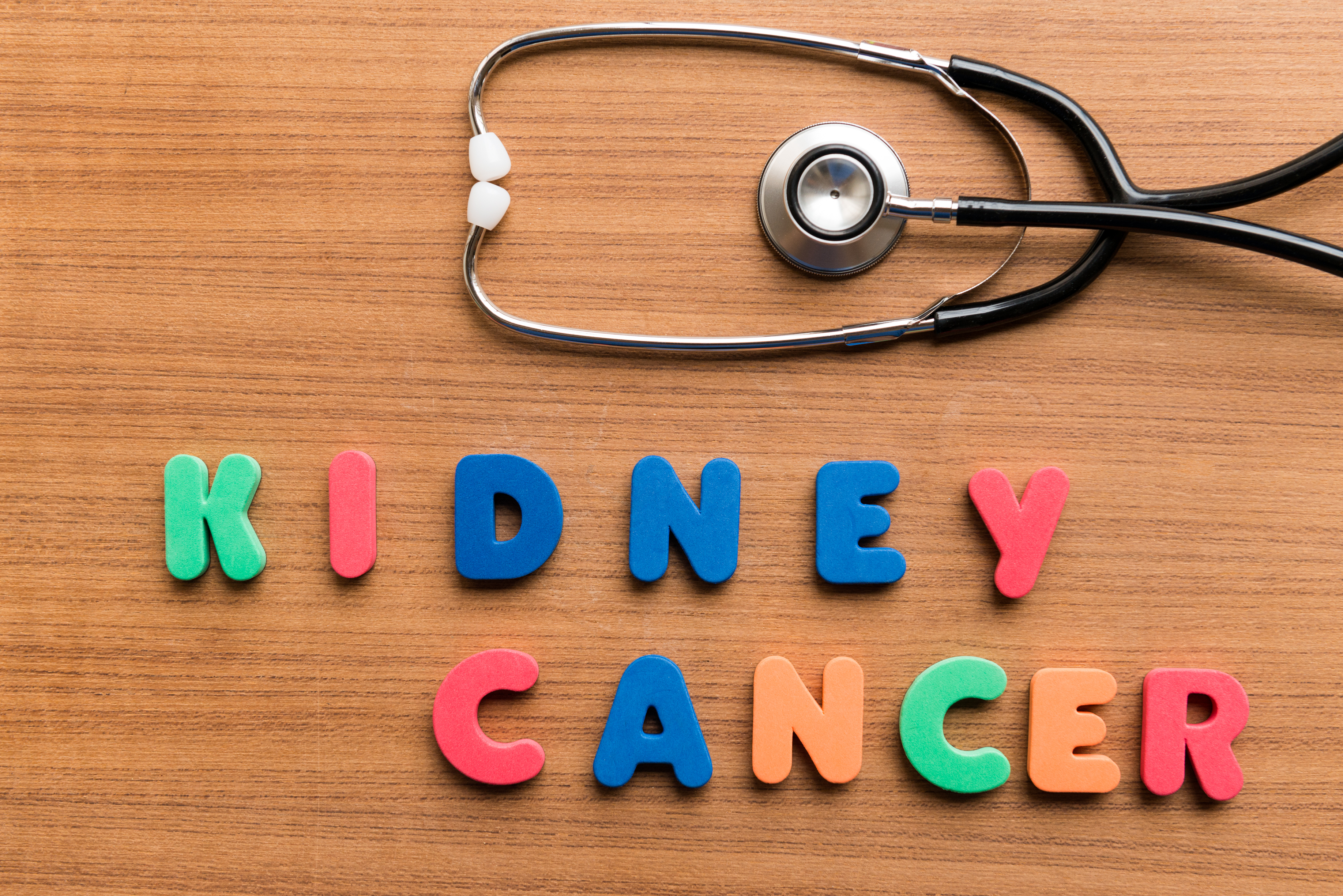 Stethoscope next to colorful block letters spelling Kidney Cancer