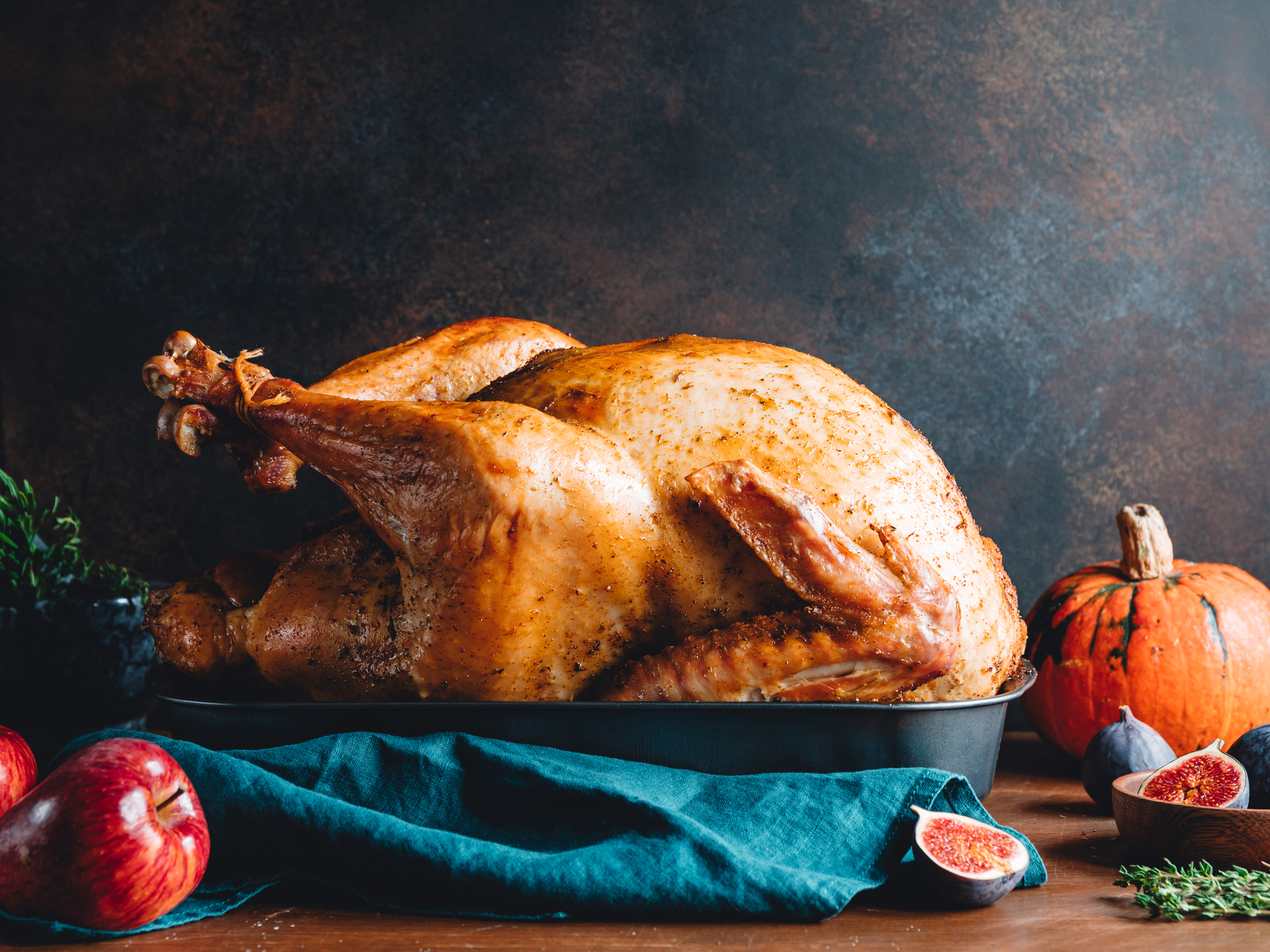 Thanksgiving Day meal with a roast turkey in the center