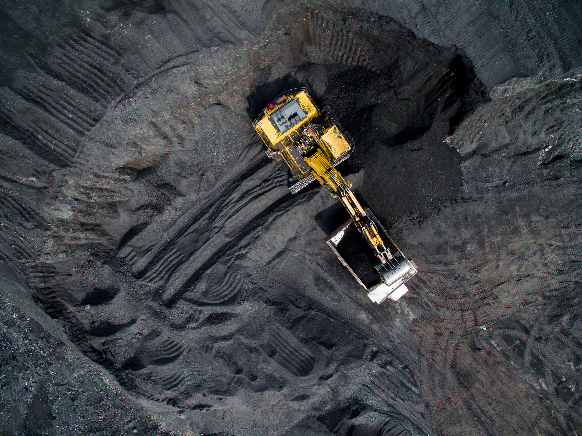 Overhead shot of excavating equipment at a coal mine.
