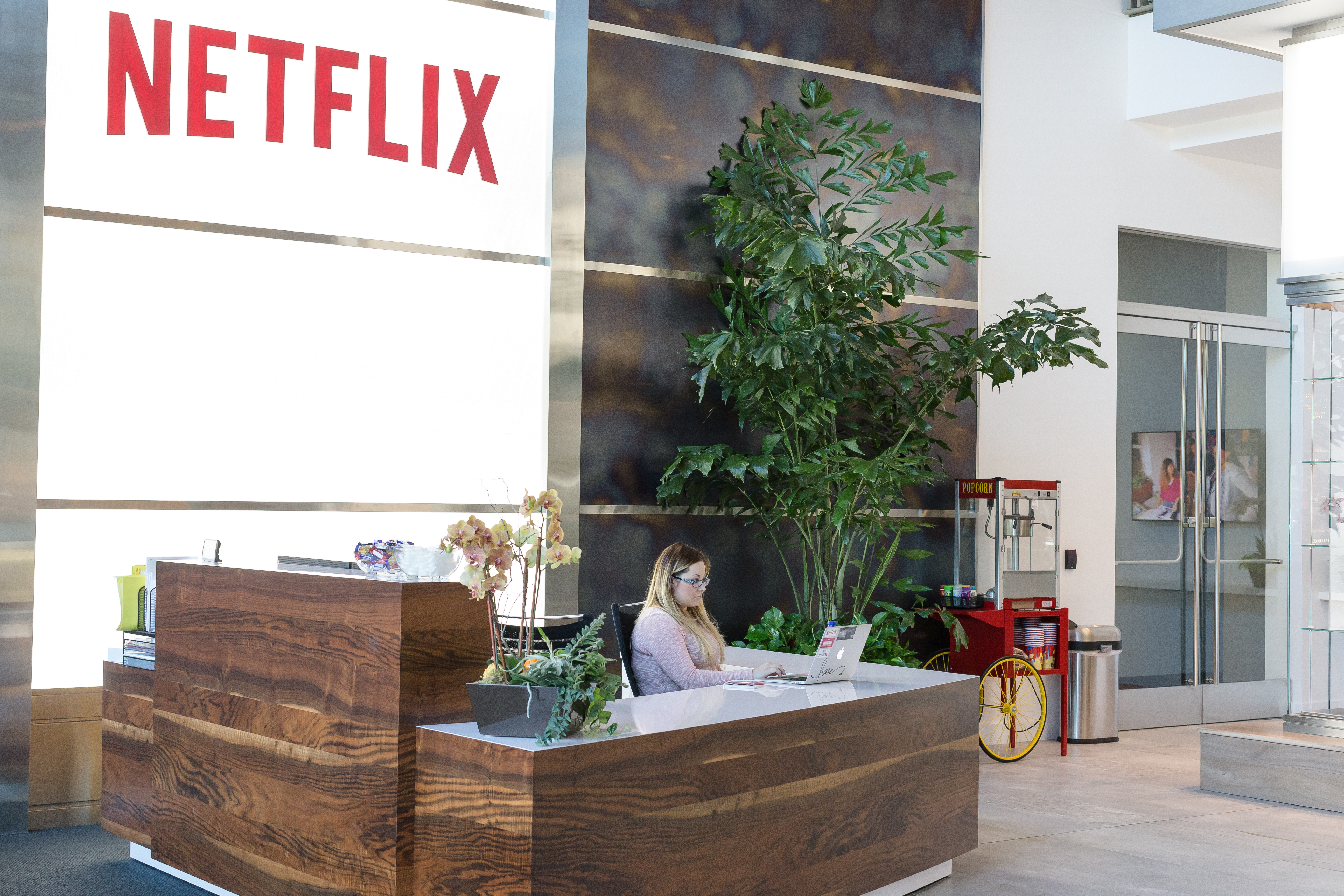 A woman sitting at the reception desk at the Netflix office