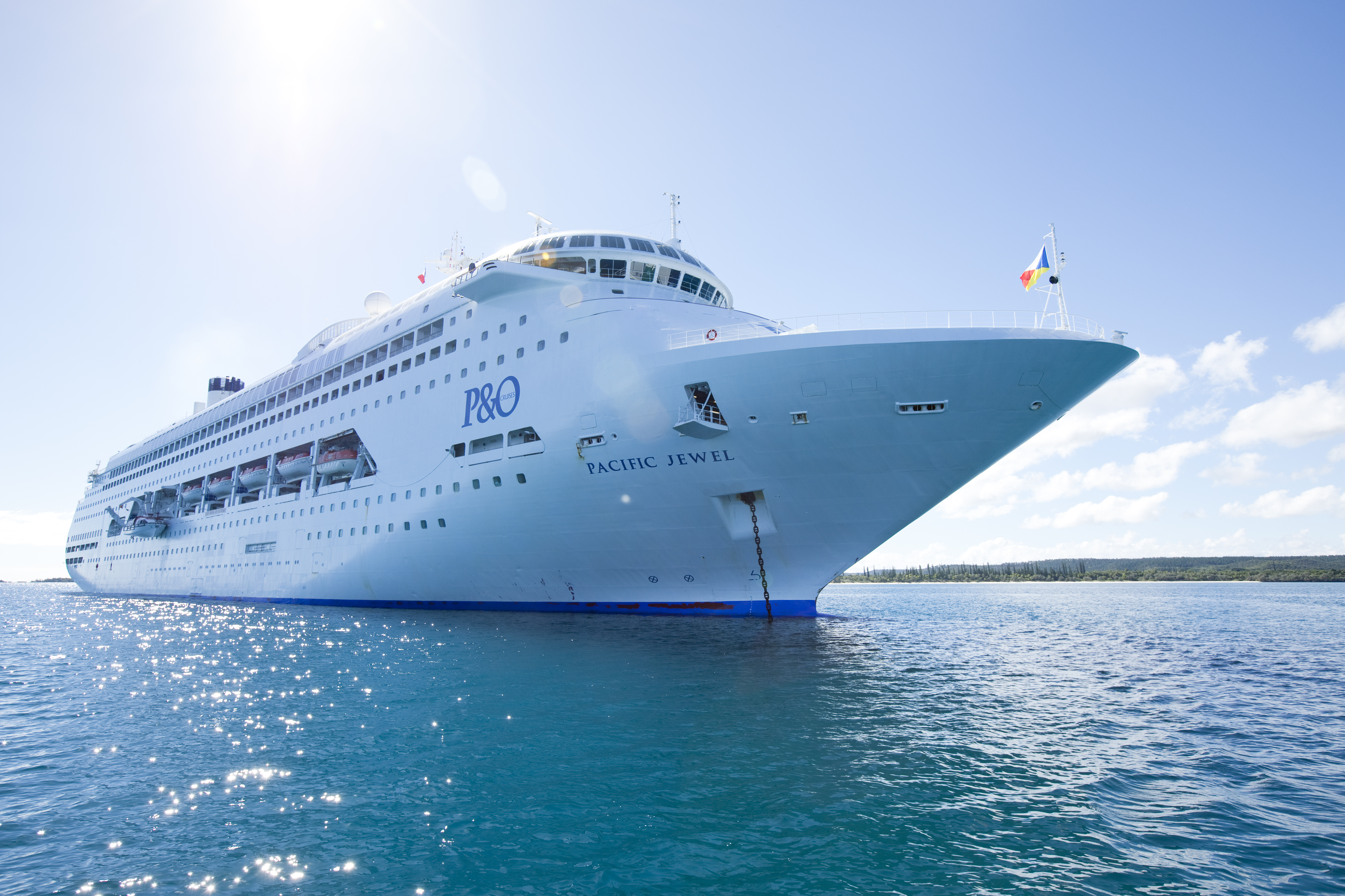 The Carnival Pacific Jewel anchored off port.