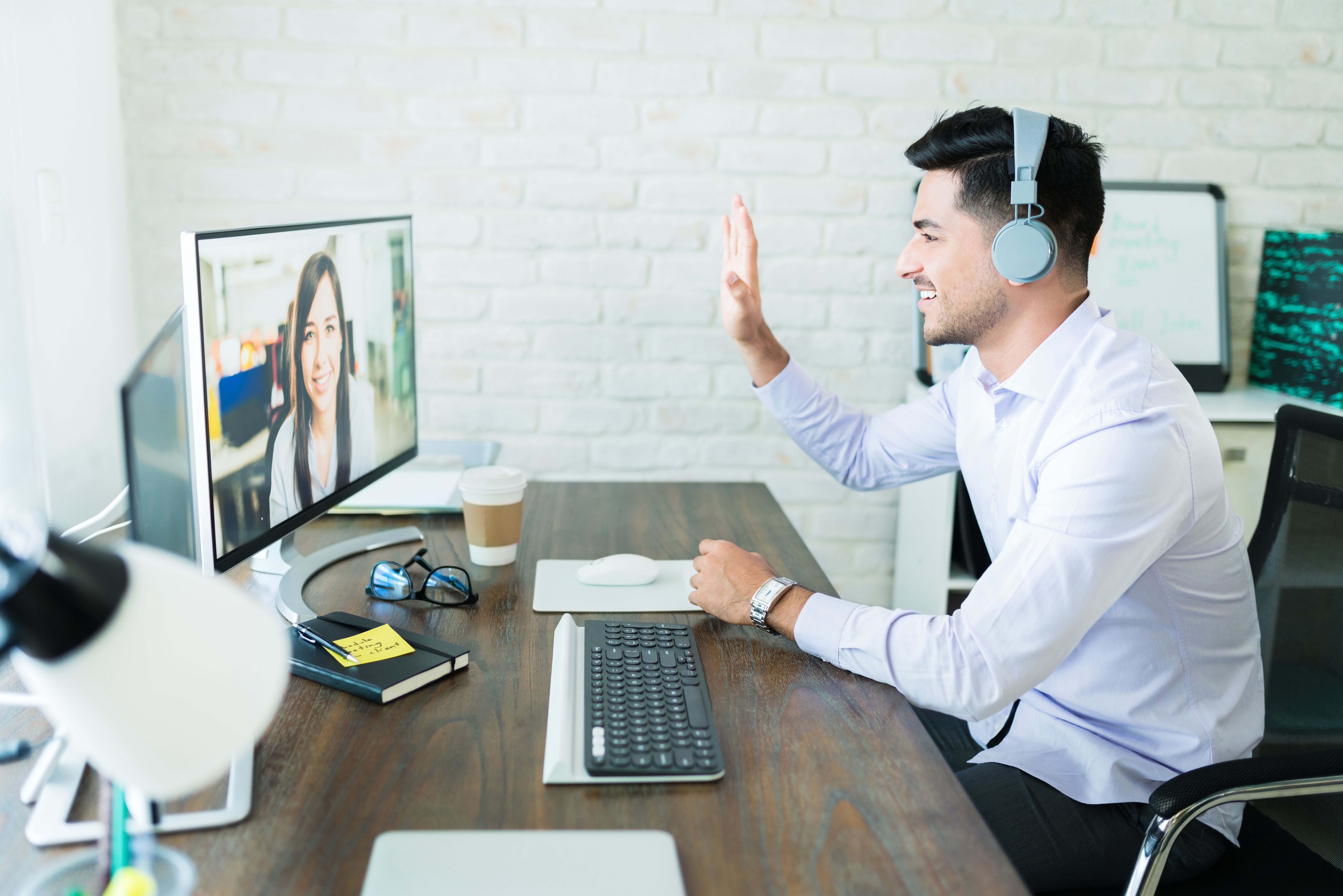 Young professional video chatting with a colleague.