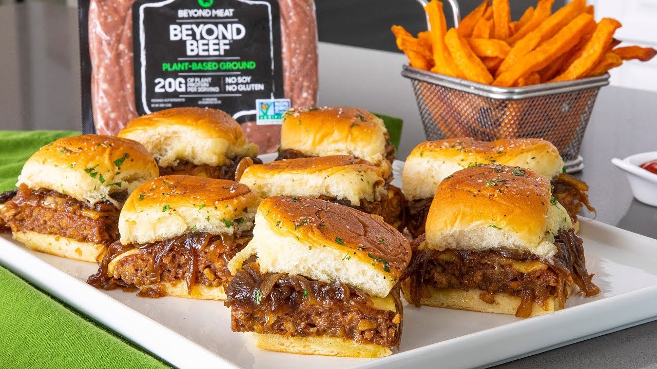 Sliders made with Beyond Beef accompanied by french fries.