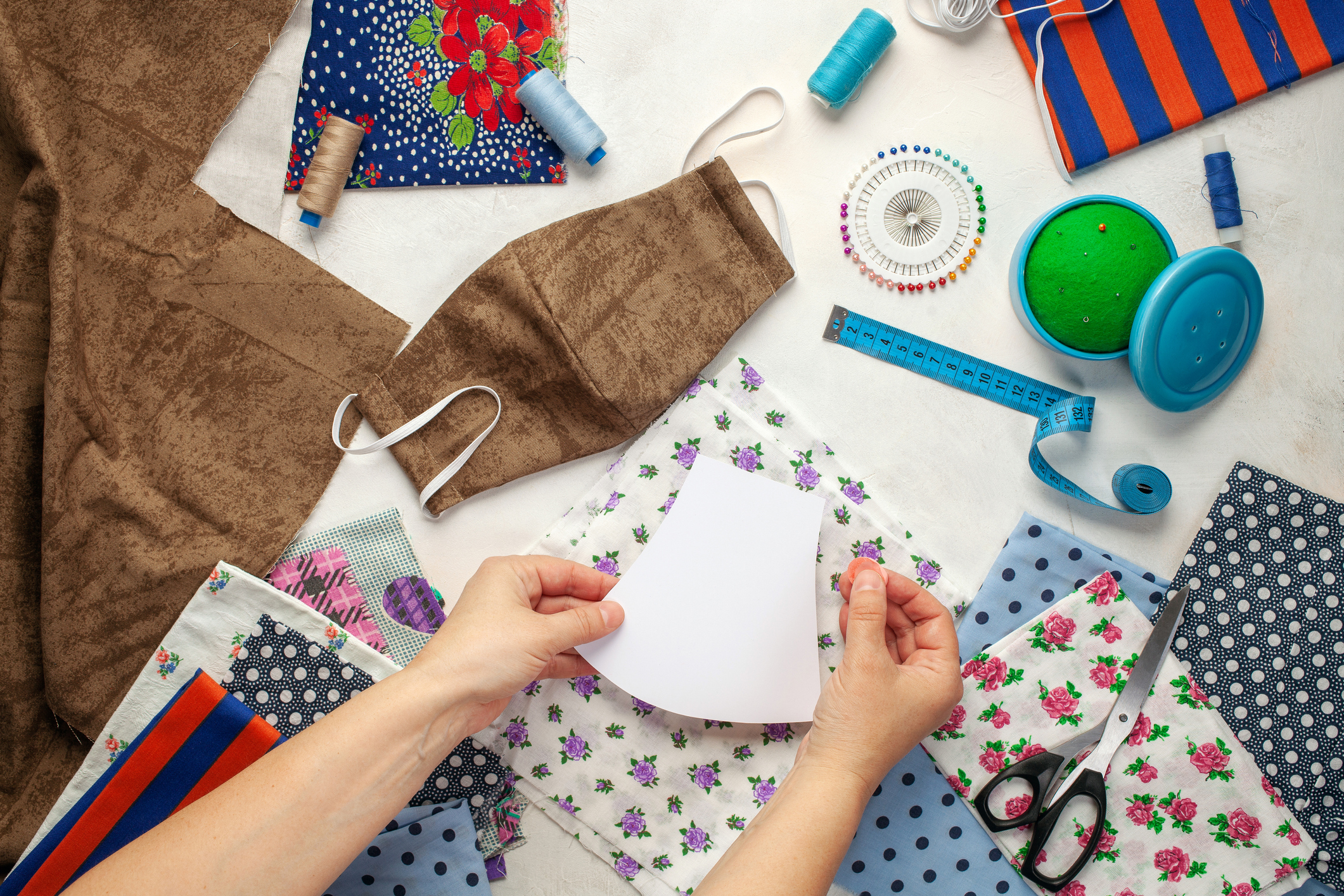 Person sewing a face mask.
