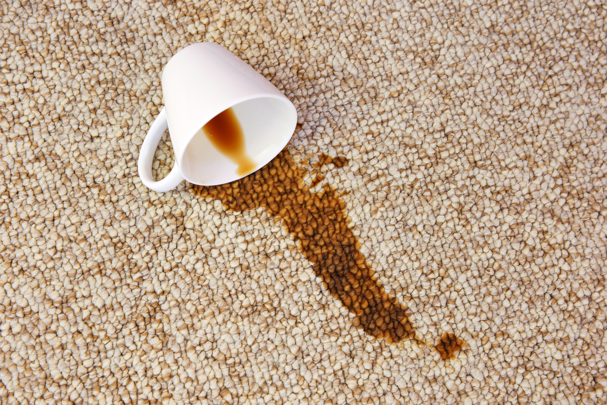 Spilled coffee on a rug.
