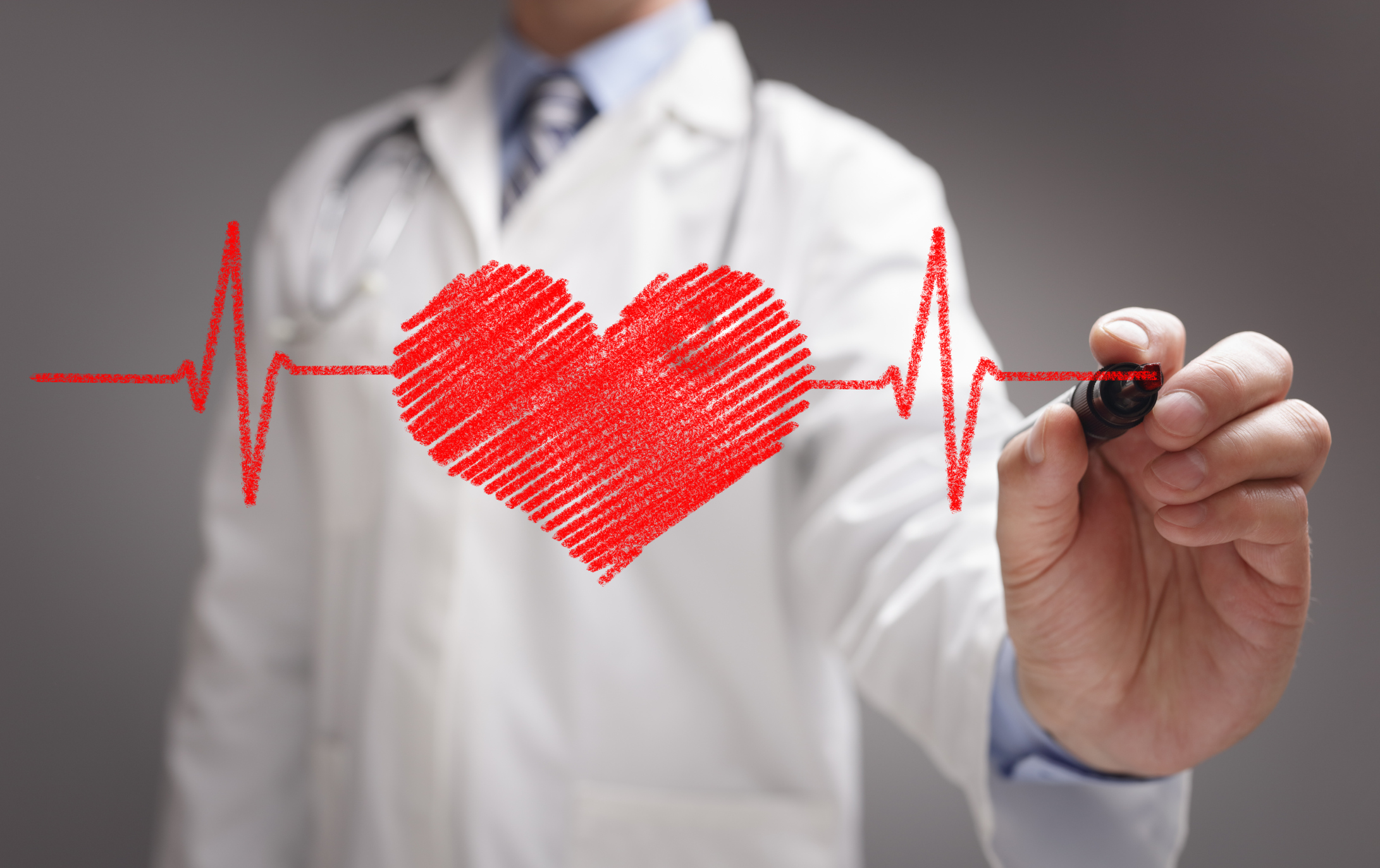 GettyImages-doctor draws ecg heartbeat chart