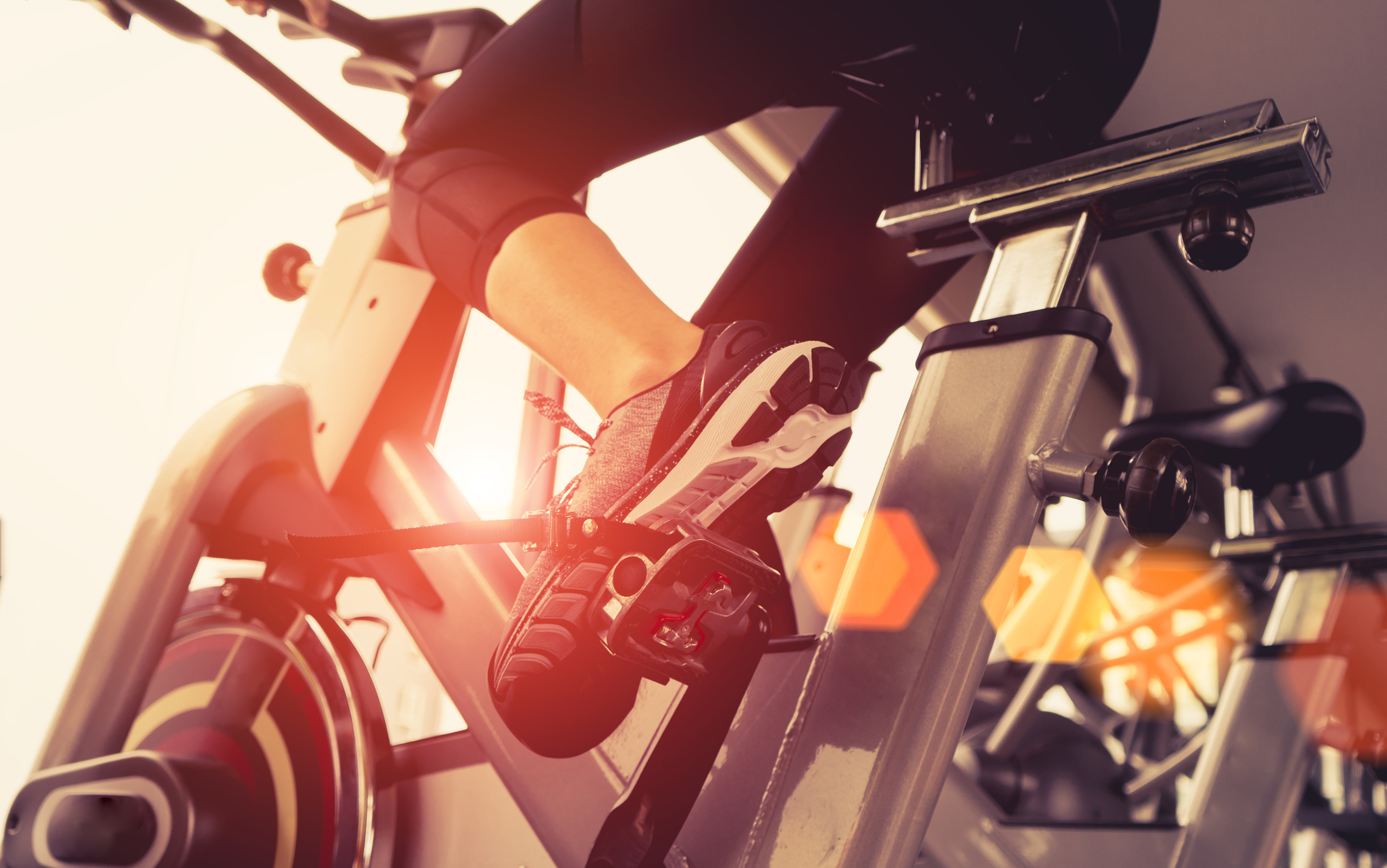 Woman using stationary bike.