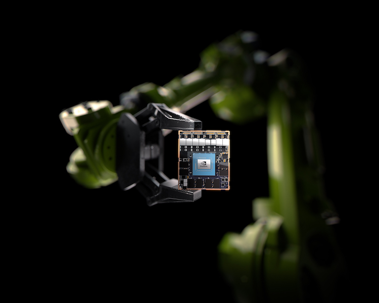 A robotic arm holding an NVIDIA chip