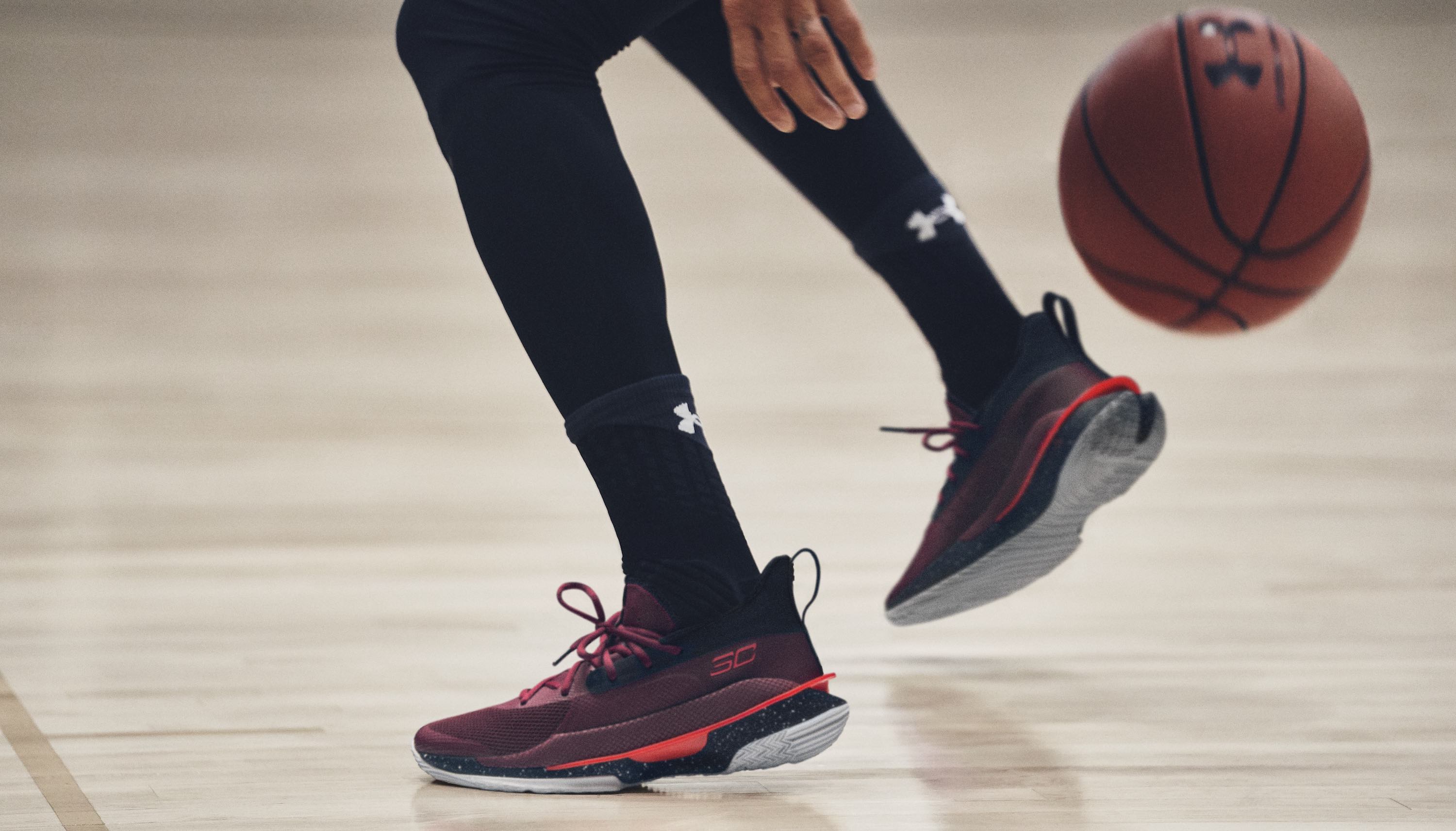 Athlete playing basketball wearing Under Armour clothes