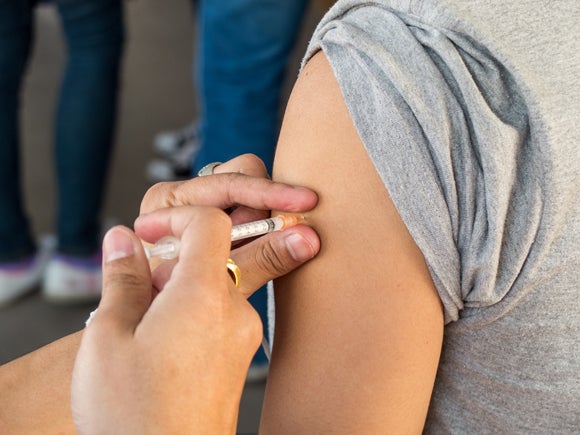 Person getting shot in arm
