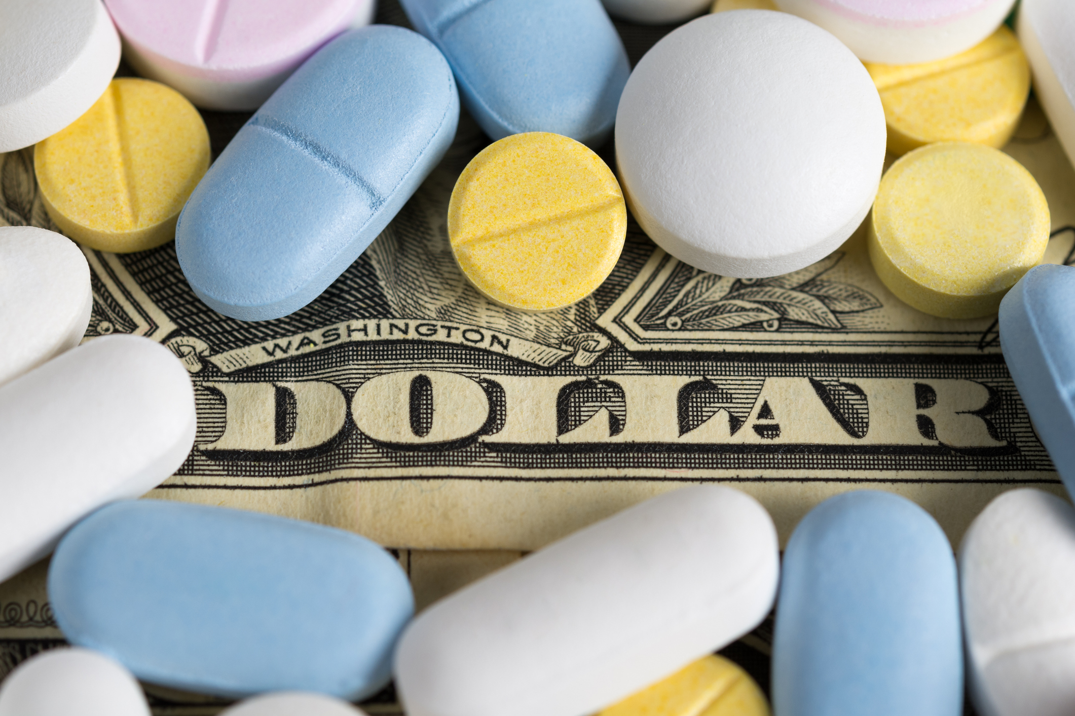 Pills and a dollar bill.