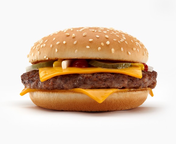 A McDonald's quarter pounder is shown sitting on a white background