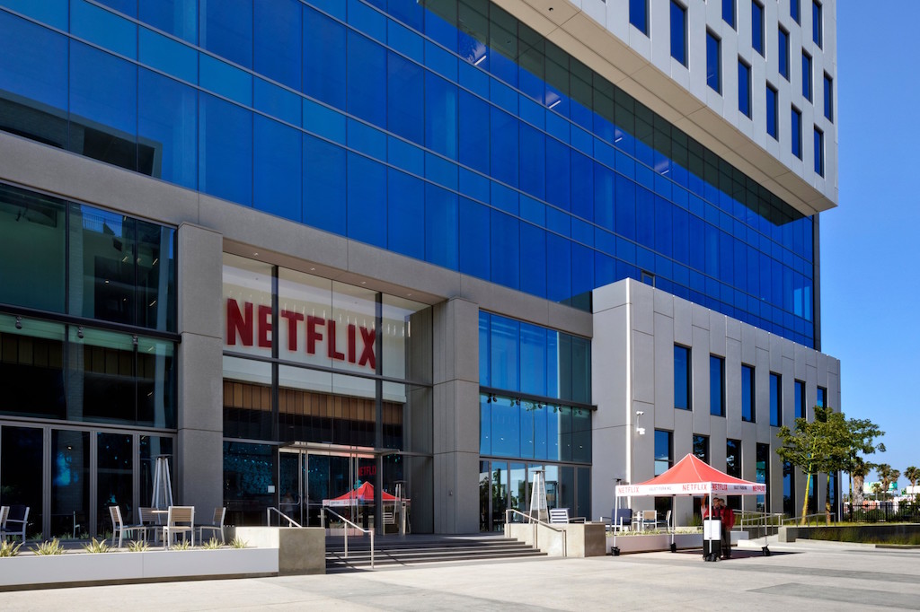 Office building with Netflix sign above entrance.